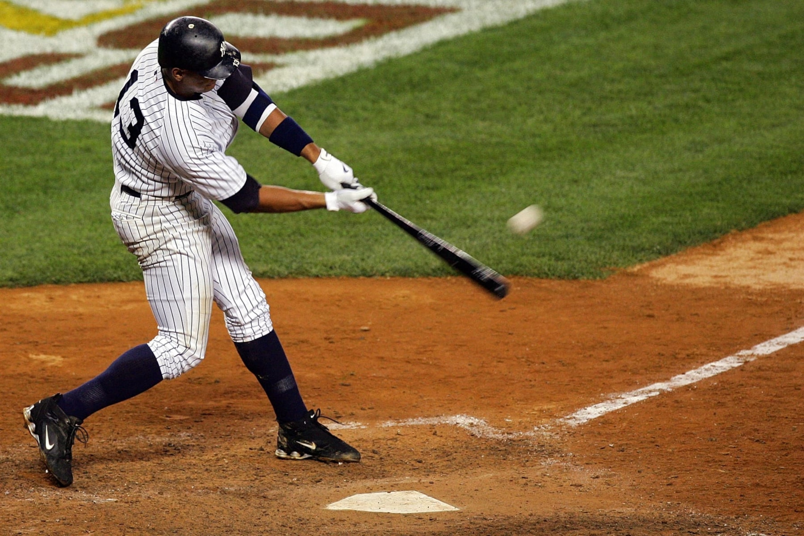 NEW YORK - OCTOBER 08:  Alex Rodriguez #13 of the New York Yankees hits a solo home run seventh inning against the Cleveland Indians during Game Four of the American League Division Series at Yankee Stadium on October 8, 2007 in the Bronx borough of New York City.  (Photo by Jim McIsaac/Getty Images)