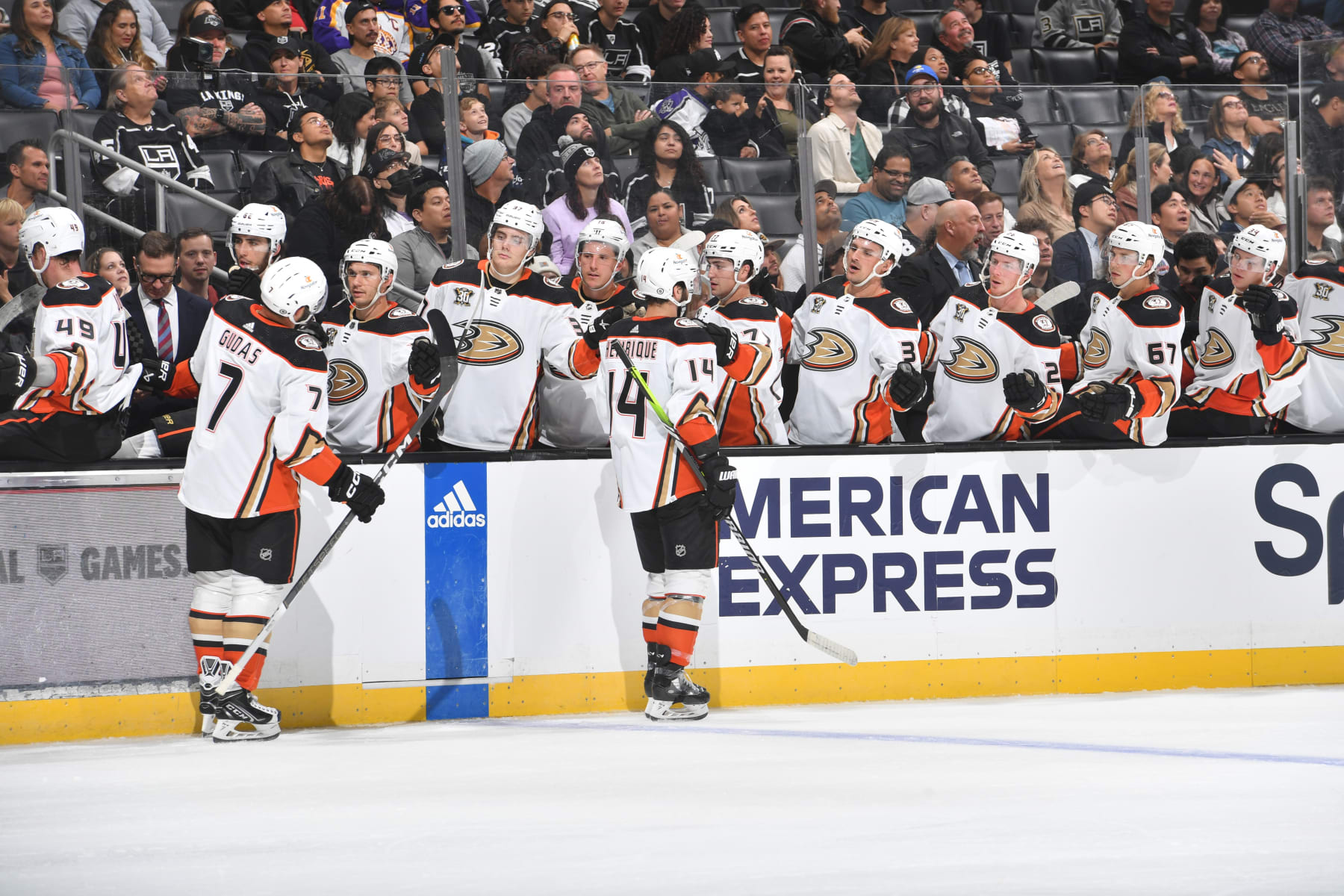 LOS ANGELES, CA - October 3: Radko Gudas #7 and Adam Henrique #14 of the Anaheim Ducks celebrate goal with teammates during the second period against the Los Angeles Kings at Crypto.com Arena on October 3, 2023 in Los Angeles, California. (Photo by Juan Ocampo/NHLI via Getty Images)