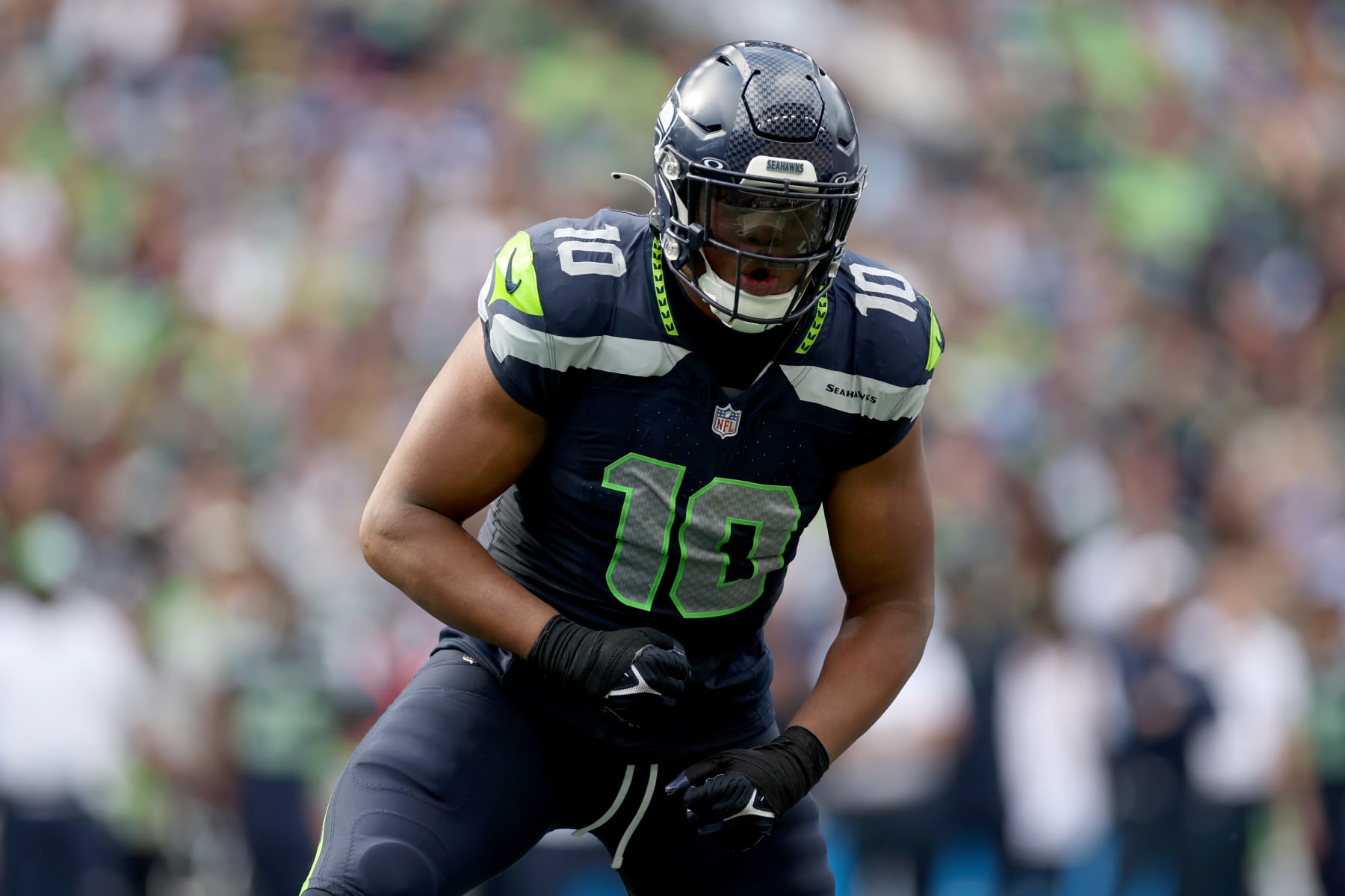 SEATTLE, WASHINGTON - SEPTEMBER 10: Uchenna Nwosu #10 of the Seattle Seahawks reacts after a stop against the Los Angeles Rams at Lumen Field on September 10, 2023 in Seattle, Washington. (Photo by Steph Chambers/Getty Images)