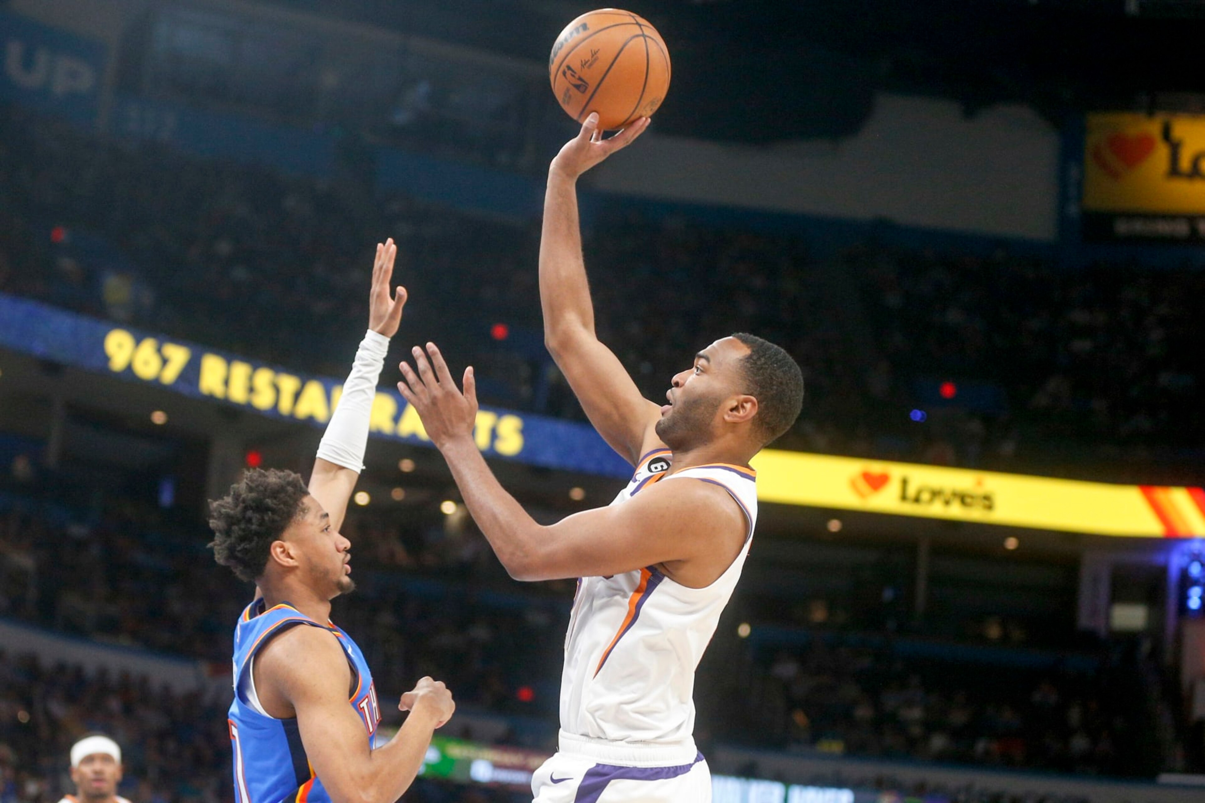 OKLAHOMA CITY, OKLAHOMA - APRIL 02: T.J. Warren #21 of the Phoenix Suns shoots over Aaron Wiggins #21 of the Oklahoma City Thunder during the first quarter at Paycom Center on April 02, 2023 in Oklahoma City, Oklahoma. NOTE TO USER: User expressly acknowledges and agrees that, by downloading and or using this photograph, User is consenting to the terms and conditions of the Getty Images License Agreement.  (Photo by Ian Maule/Getty Images)