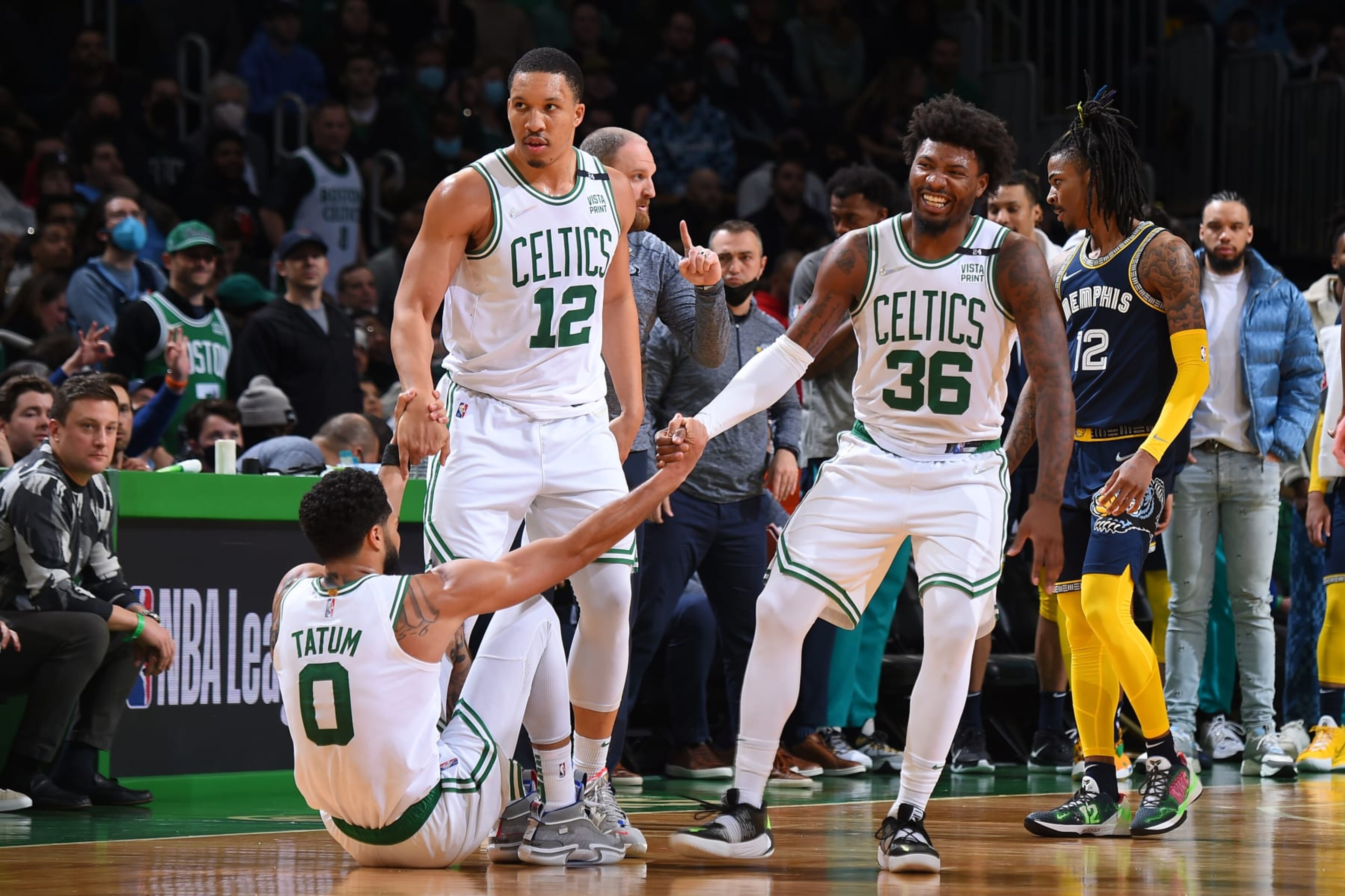 BOSTON, MA - MARCH 3: Grant Williams #12 and Marcus Smart #36 help up Jayson Tatum #0 of the Boston Celtics during the game against the Memphis Grizzlies on March 3, 2022 at the TD Garden in Boston, Massachusetts. NOTE TO USER: User expressly acknowledges and agrees that, by downloading and or using this photograph, User is consenting to the terms and conditions of the Getty Images License Agreement. Mandatory Copyright Notice: Copyright 2022 NBAE (Photo by Brian Babineau/NBAE via Getty Images) BOSTON, MA - MARCH 3: Grant Williams #12 and Marcus Smart #36 help up Jayson Tatum #0 of the Boston Celtics during the game against the Memphis Grizzlies on March 3, 2022 at the TD Garden in Boston, Massachusetts. NOTE TO USER: User expressly acknowledges and agrees that, by downloading and or using this photograph, User is consenting to the terms and conditions of the Getty Images License Agreement. Mandatory Copyright Notice: Copyright 2022 NBAE (Photo by Brian Babineau/NBAE via Getty Images)
