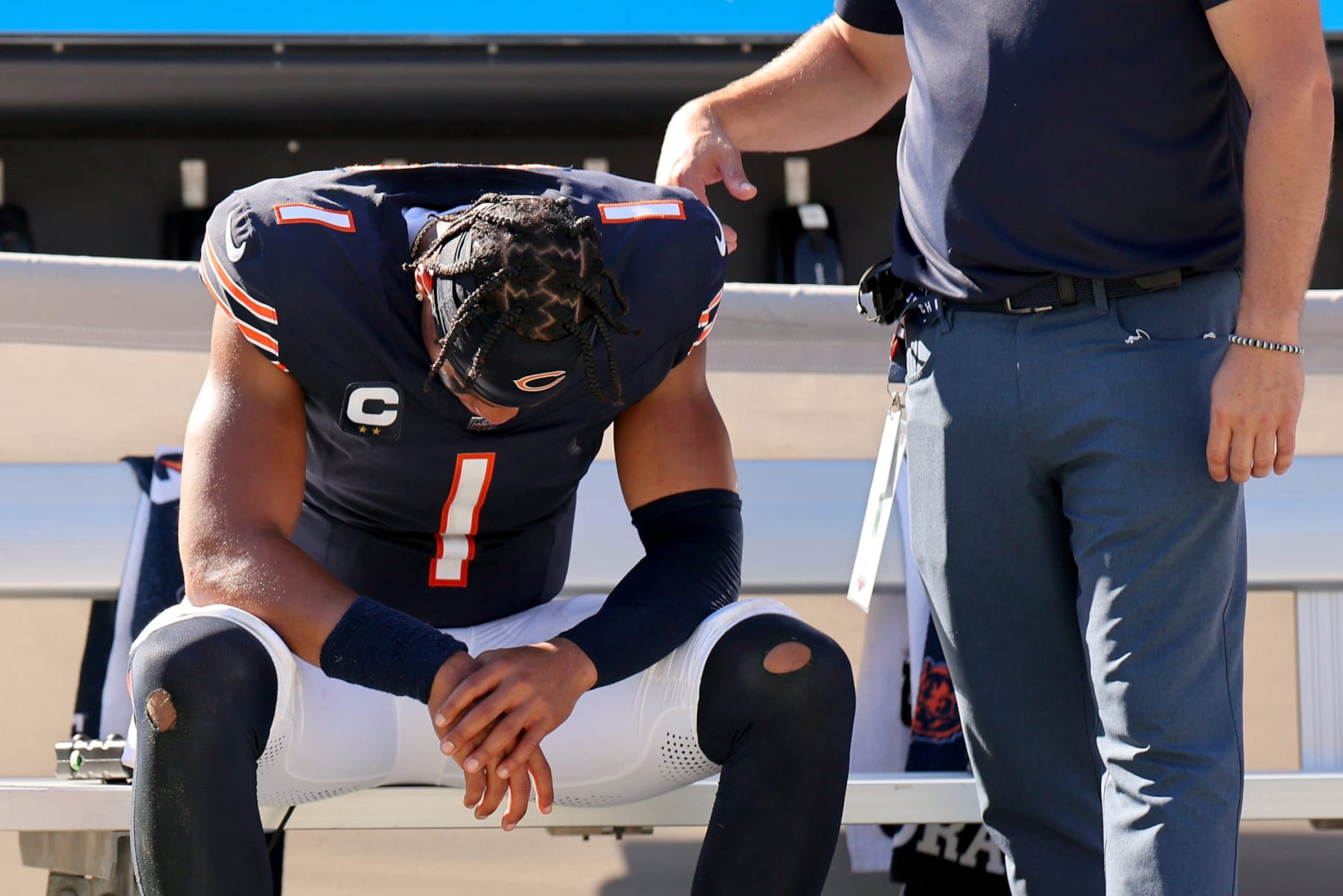 CHICAGO, ILLINOIS - OCTOBER 01: Justin Fields #1 of the Chicago Bears sits on the bench with his head down after the game against the Denver Broncos at Soldier Field on October 01, 2023 in Chicago, Illinois. Denver defeats Chicago 31-28. (Photo by Michael Reaves/Getty Images)