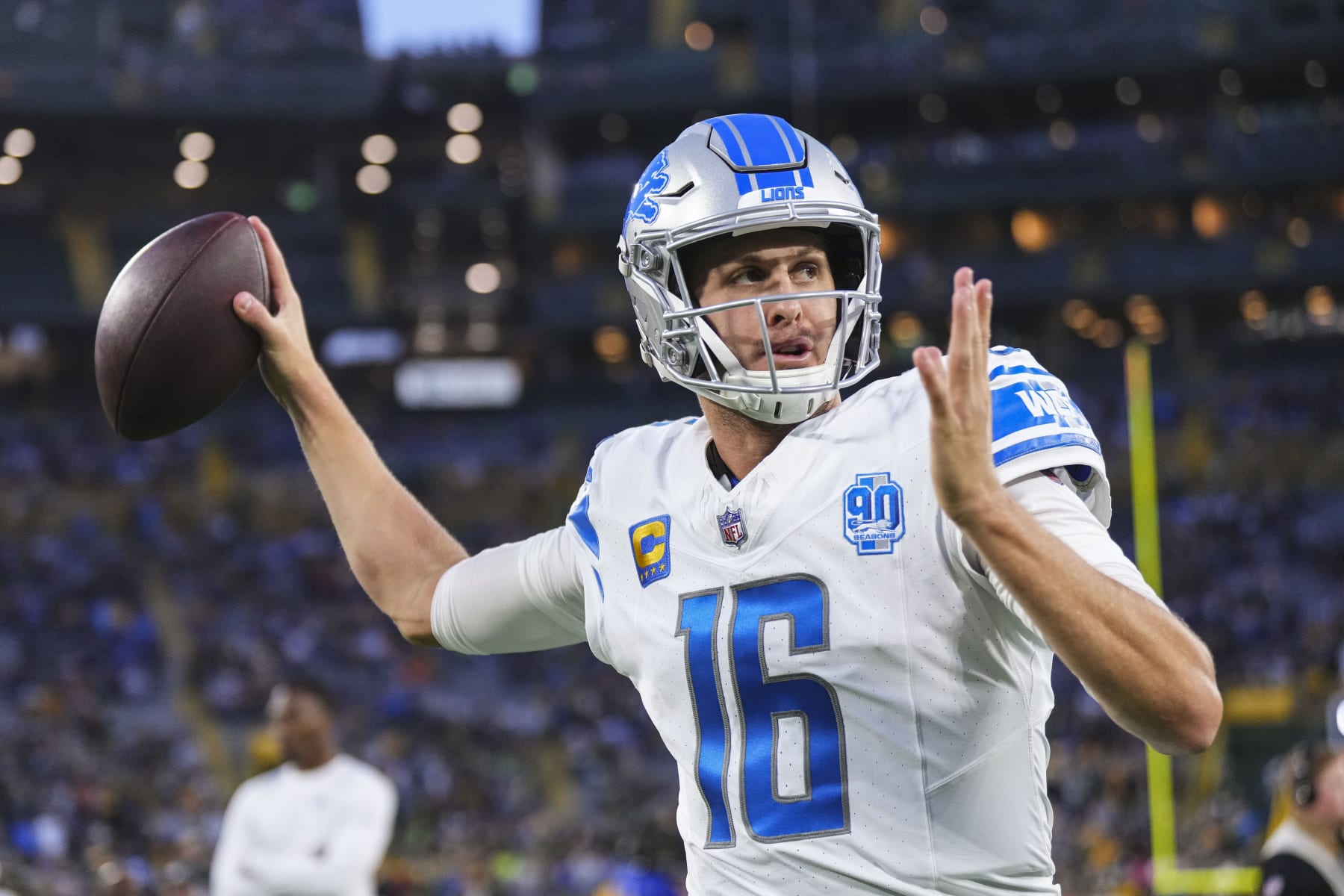 GREEN BAY, WI - SEPTEMBER 28: Jared Goff #16 of the Detroit Lions warms up prior to at Lambeau Field on September 28, 2023 in Green Bay, Wisconsin. (Photo by Cooper Neill/Getty Images)