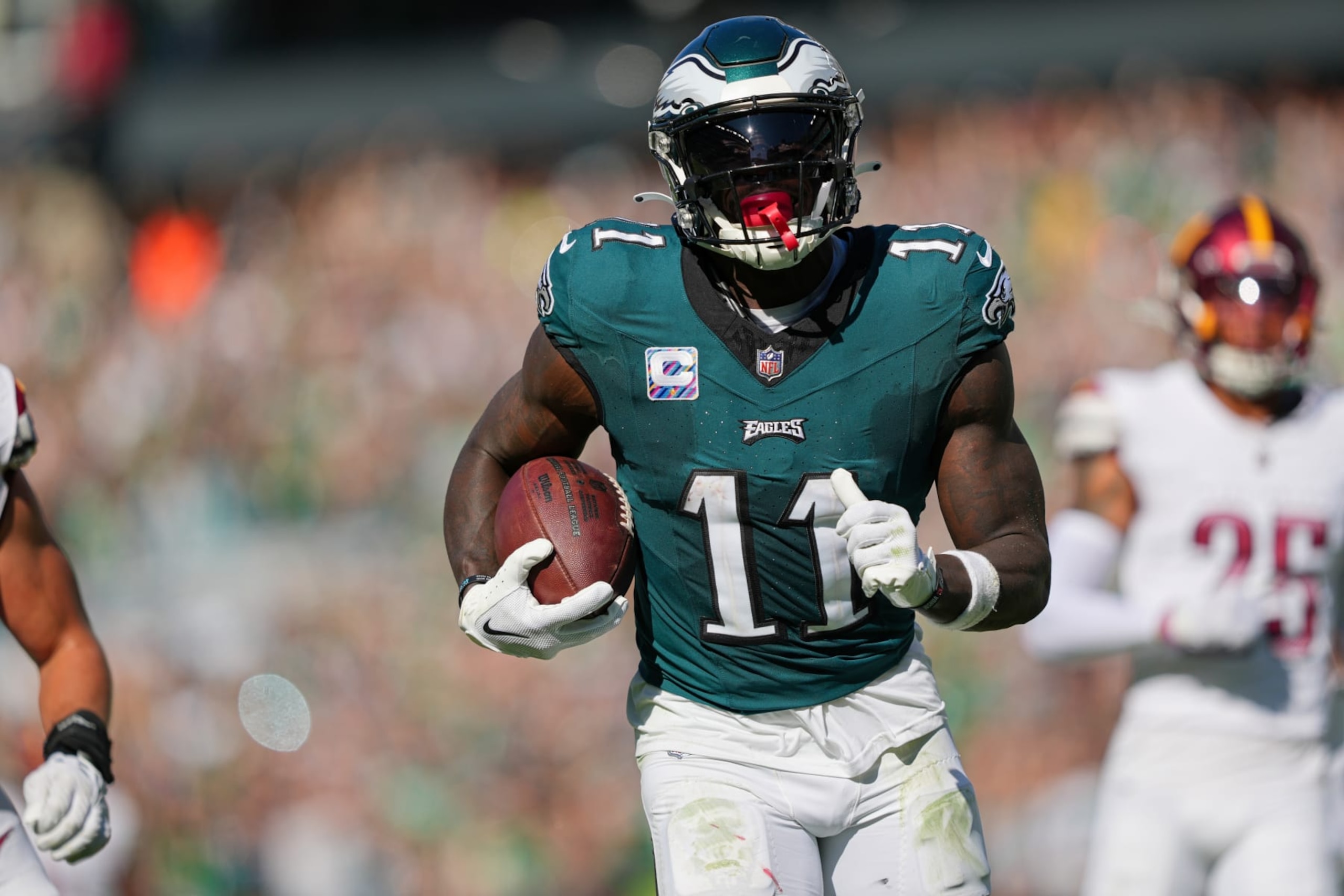 PHILADELPHIA, PA - OCTOBER 01: Philadelphia Eagles wide receiver A.J. Brown (11) runs for a touchdown during the game between the Philadelphia Eagles and the Washington Commanders on October 1, 2023, at Lincoln Financial Field. (Photo by Andy Lewis/Icon Sportswire via Getty Images)