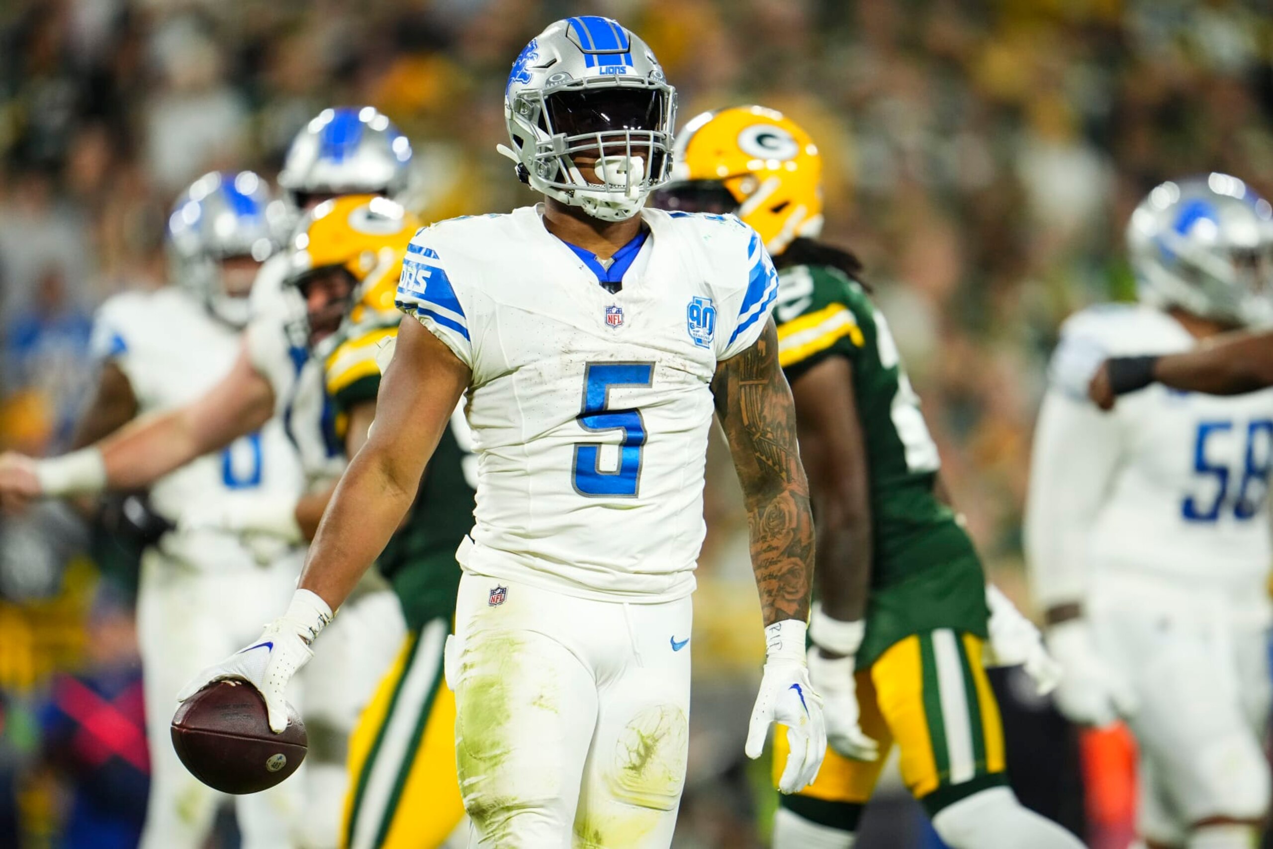 GREEN BAY, WI - SEPTEMBER 28: David Montgomery #5 of the Detroit Lions celebrates during an NFL football game at Lambeau Field on September 28, 2023 in Green Bay, Wisconsin. (Photo by Cooper Neill/Getty Images)
