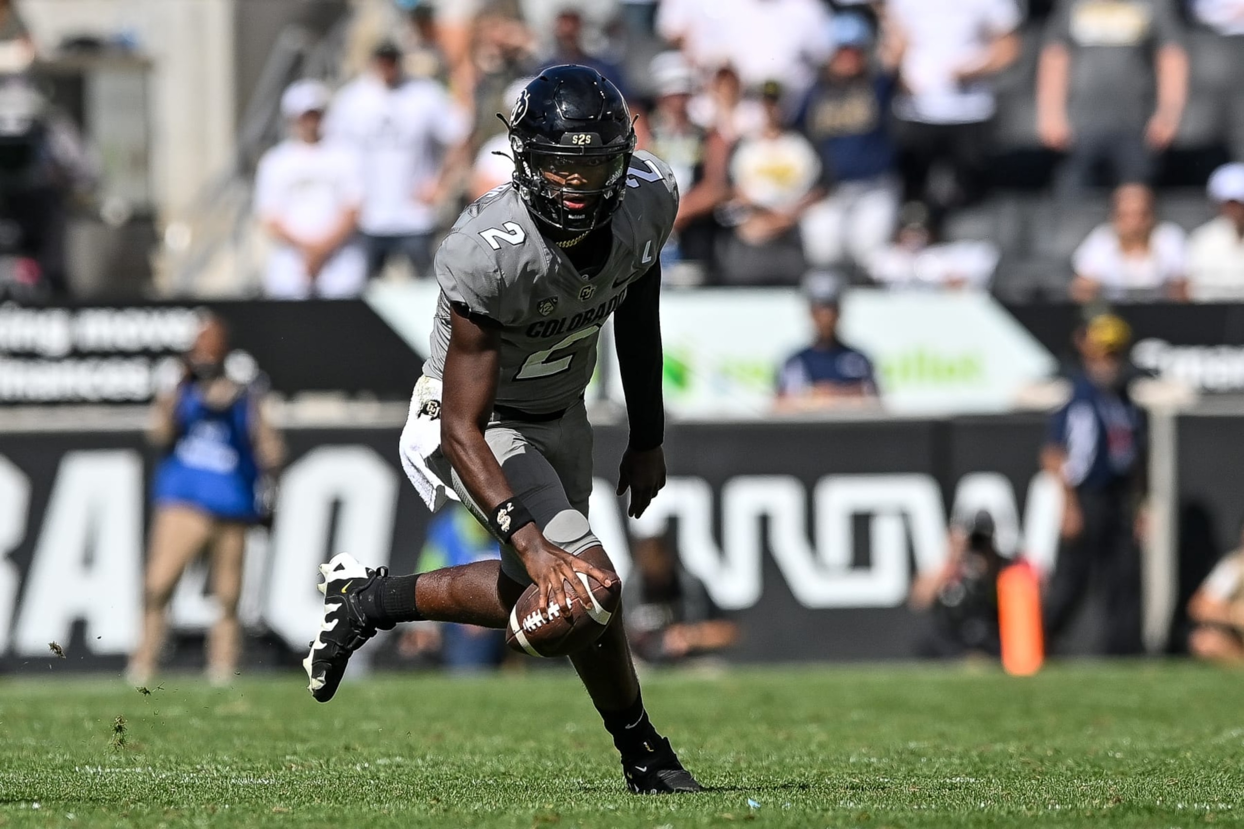 BOULDER, CO - SEPTEMBER 30:  Quarterback Shedeur Sanders #2 of the Colorado Buffaloes rolls out of the pocket in the fourth quarter against the USC Trojans at Folsom Field on September 30, 2023 in Boulder, Colorado. (Photo by Dustin Bradford/Getty Images)
