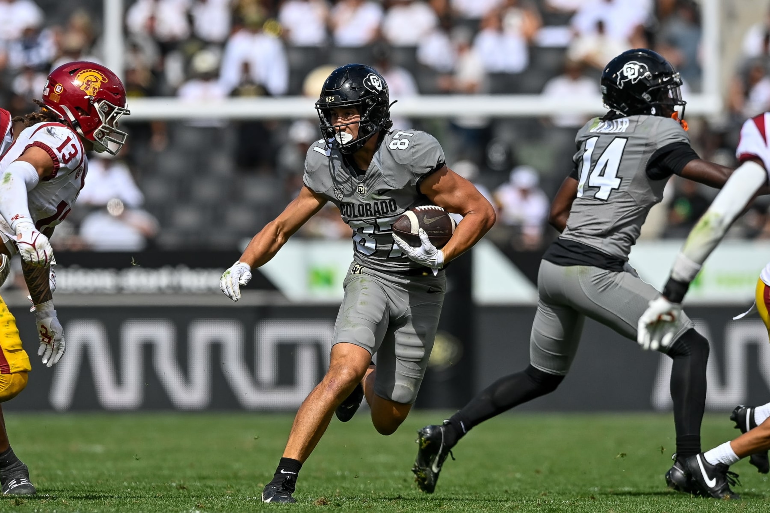 BOULDER, CO - SEPTEMBER 30:  Tight end Michael Harrison #87 of the Colorado Buffaloes runs after a catch in the fourth quarter against the USC Trojans at Folsom Field on September 30, 2023 in Boulder, Colorado. (Photo by Dustin Bradford/Getty Images)
