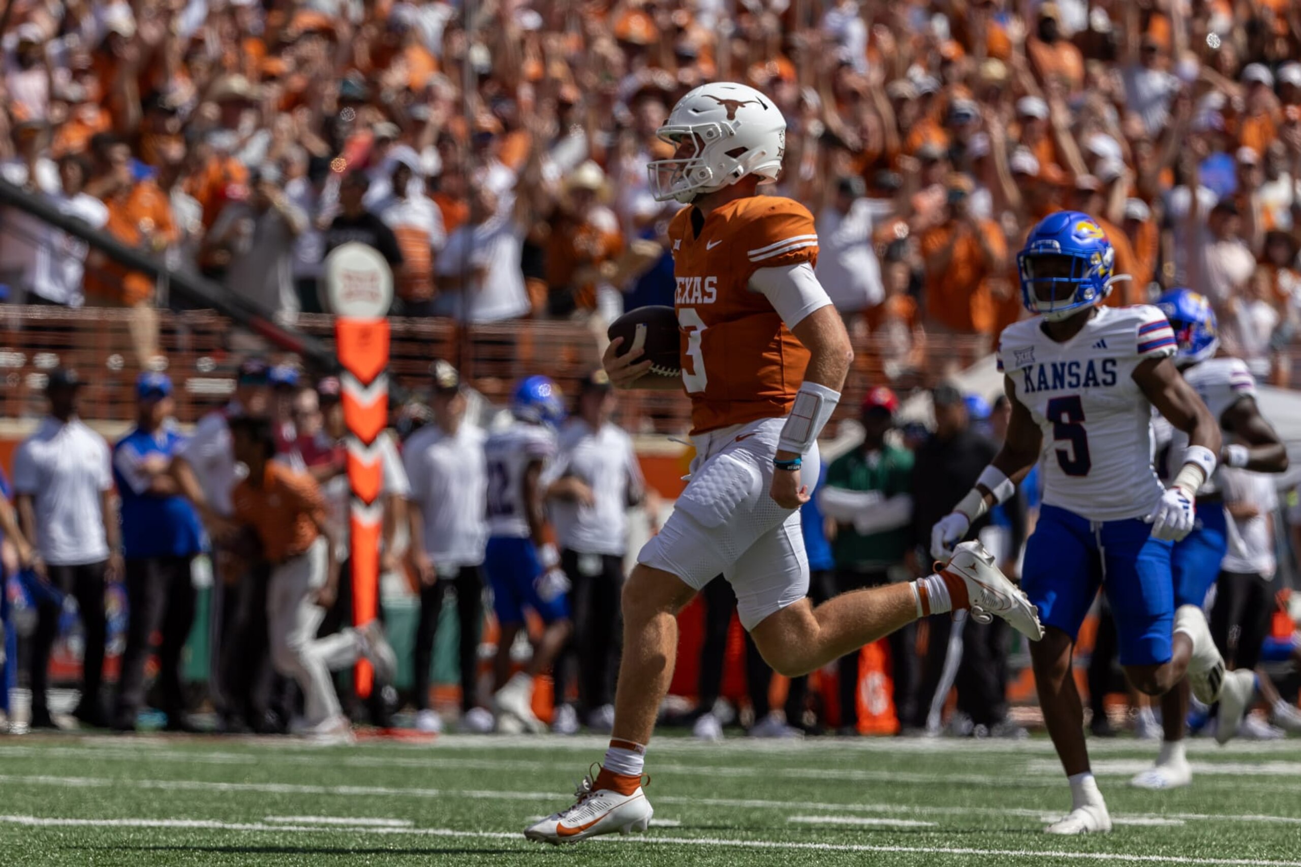 AUSTIN, TX - SEPTEMBER 30: Texas Longhorns quarterback Quinn Ewers (3) runs toward the endzone for a touchdown during the Big 12 football game between Texas Longhorns and Kansas Jayhawks on September 30, 2023, at Darrell K Royal-Texas Memorial Stadium in Austin, TX. (Photo by David Buono/Icon Sportswire via Getty Images)