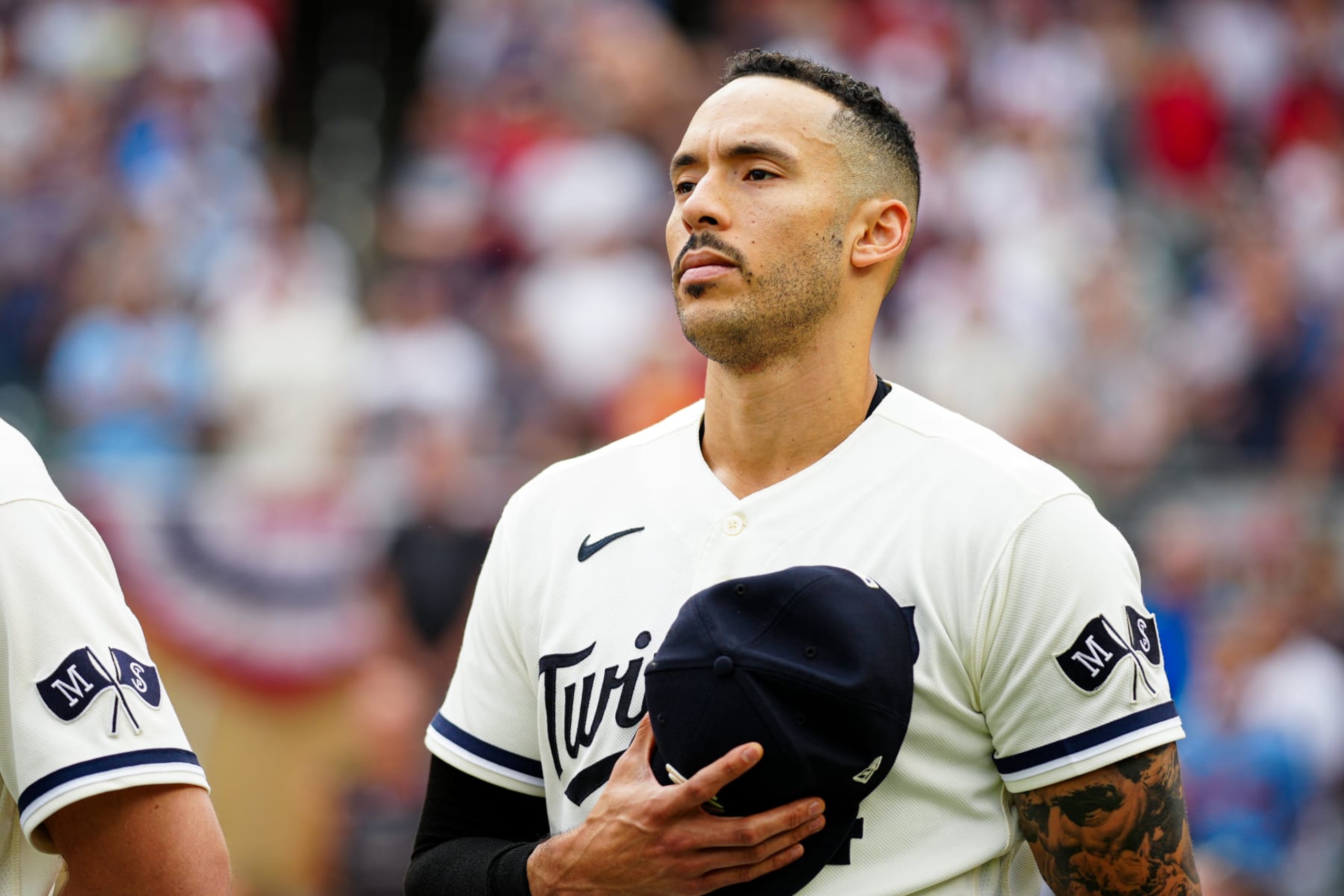 MINNEAPOLIS, MN - OCTOBER 03: Carlos Correa #4 of the Minnesota Twins looks on during the national anthem before Game 1 of the Wild Card Series between the Toronto Blue Jays and the Minnesota Twins at Target Field on Tuesday, October 3, 2023 in Minneapolis, Minnesota. (Photo by Daniel Shirey/MLB Photos via Getty Images)