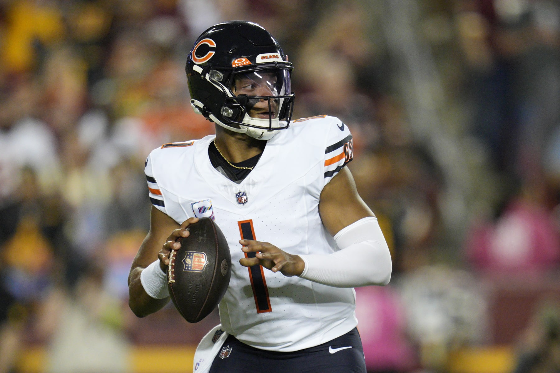 LANDOVER, MARYLAND - OCTOBER 05: Justin Fields #1 of the Chicago Bears looks to pass during the first half against the Washington Commanders at FedExField on October 05, 2023 in Landover, Maryland. (Photo by Jess Rapfogel/Getty Images)