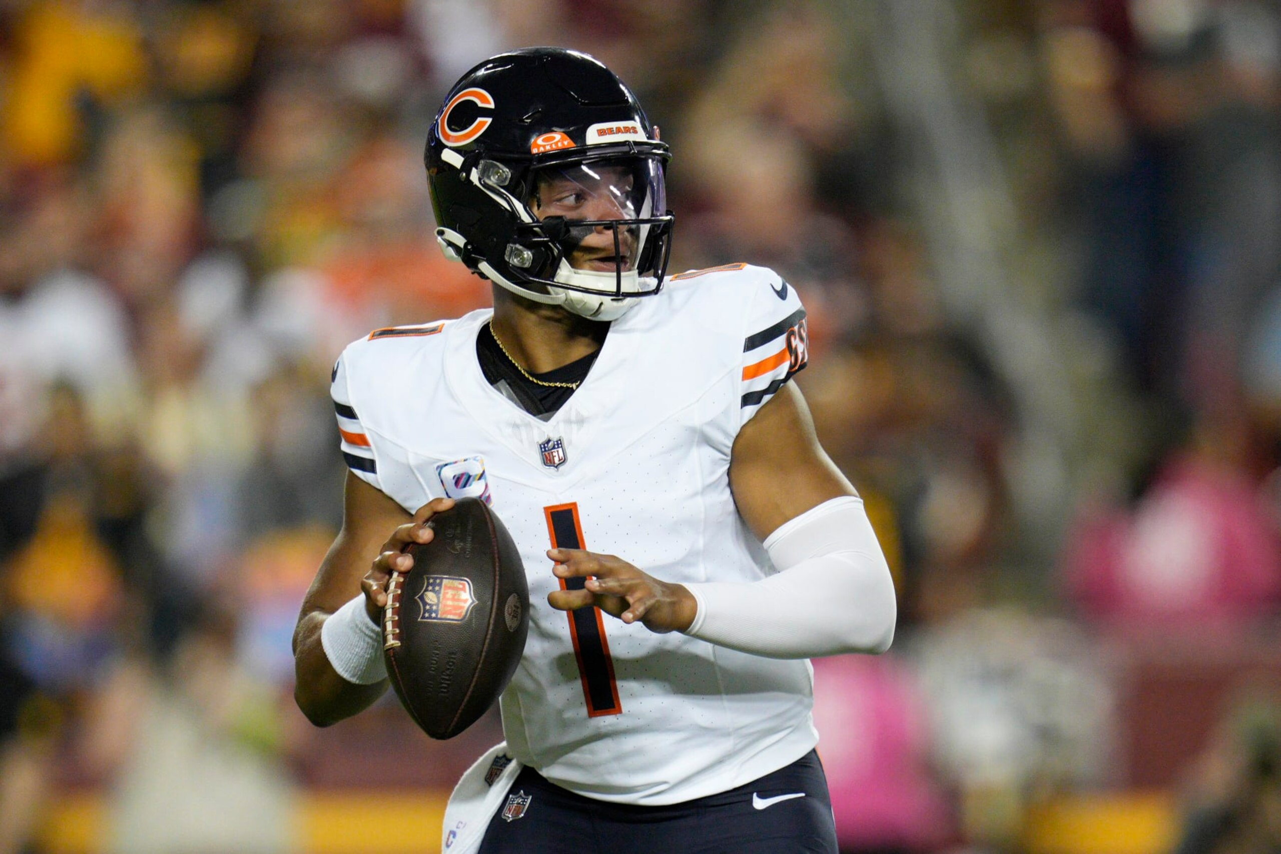 LANDOVER, MARYLAND - OCTOBER 05: Justin Fields #1 of the Chicago Bears looks to pass during the first half against the Washington Commanders at FedExField on October 05, 2023 in Landover, Maryland. (Photo by Jess Rapfogel/Getty Images)