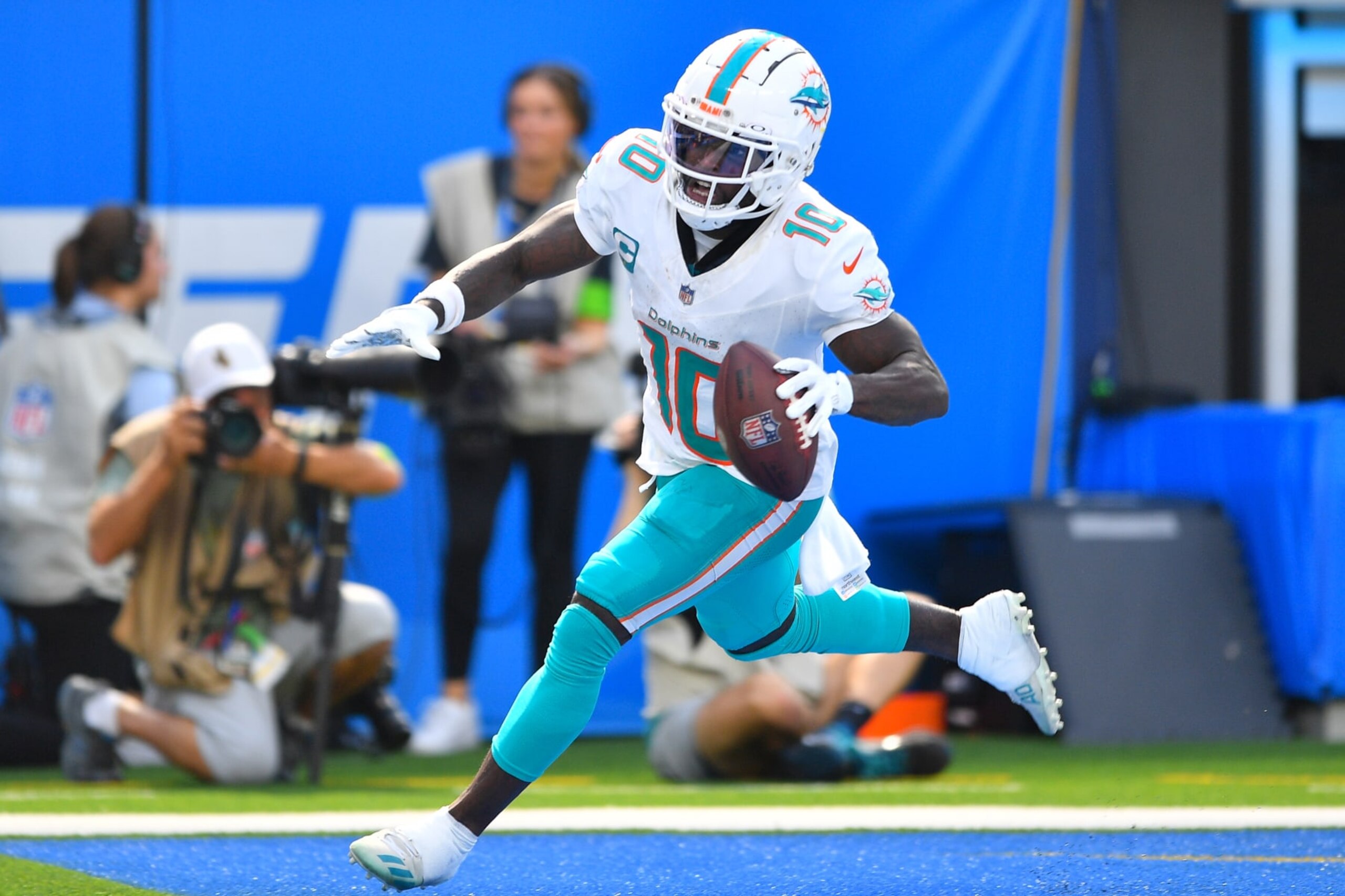 INGLEWOOD, CA - SEPTEMBER 10: Miami Dolphins wide receiver Tyreek Hill (10) celebrates after a touchdown catch during the NFL regular season game between the Miami Dolphins and the Los Angeles Chargers on September 10, 2023, at SoFi Stadium in Inglewood, CA. (Photo by Brian Rothmuller/Icon Sportswire via Getty Images)