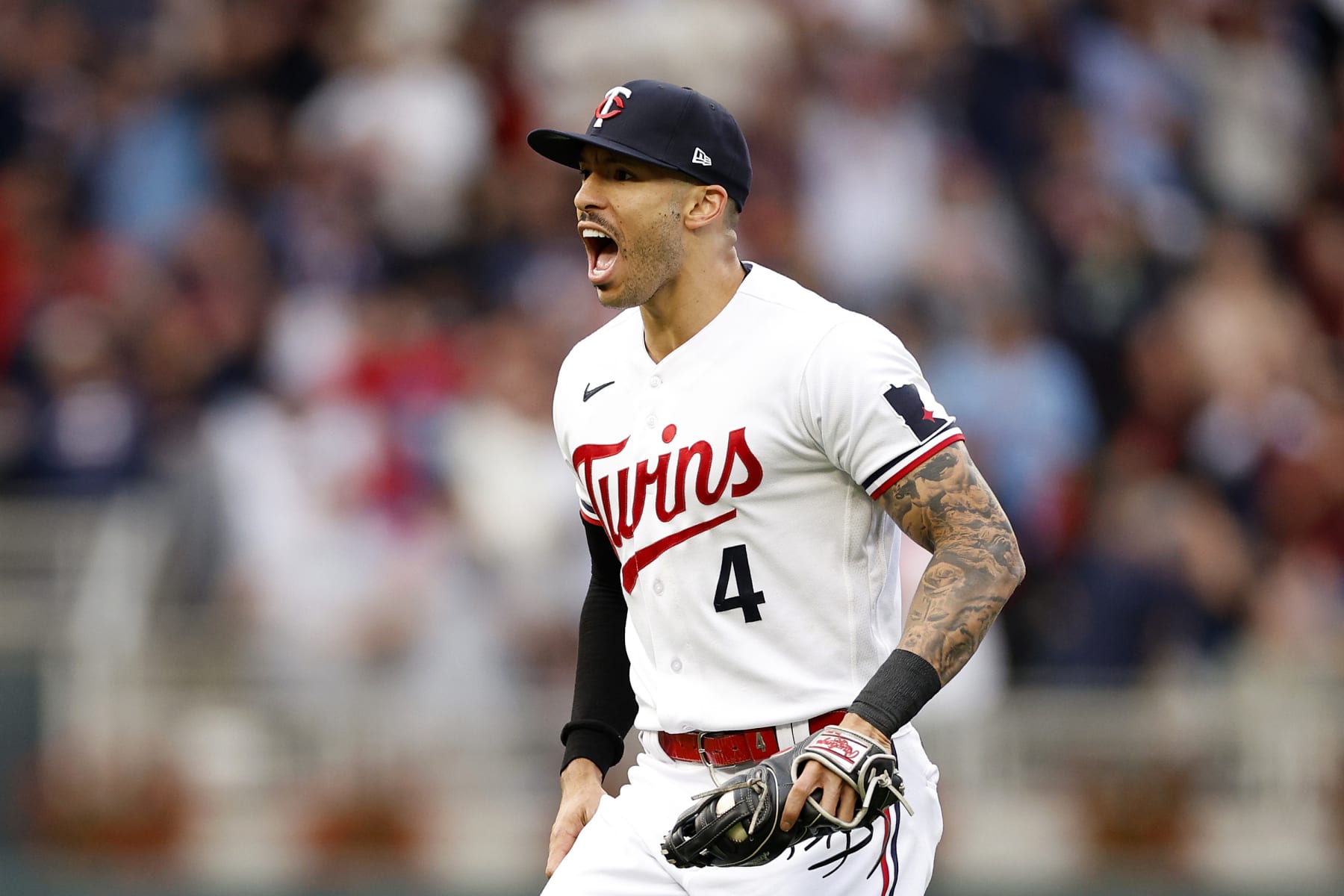 MINNEAPOLIS, MINNESOTA - OCTOBER 04: Carlos Correa #4 of the Minnesota Twins celebrates after tagging out Vladimir Guerrero Jr. #27 of the Toronto Blue Jays at second base during the fifth inning in Game Two of the Wild Card Series at Target Field on October 04, 2023 in Minneapolis, Minnesota. (Photo by David Berding/Getty Images)