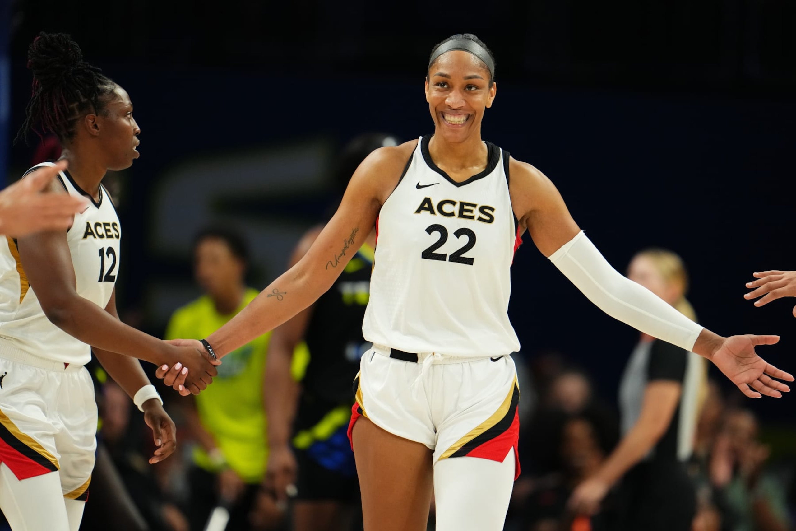 ARLINGTON, TX -  SEPTEMBER 29: A'ja Wilson #22 of the Las Vegas Aces high fives teammates during the game against the Dallas Wings on September 29, 2023 at the College Park Center in Arlington, TX. NOTE TO USER: User expressly acknowledges and agrees that, by downloading and or using this photograph, User is consenting to the terms and conditions of the Getty Images License Agreement. Mandatory Copyright Notice: Copyright 2023 NBAE (Photo by Cooper Neill/NBAE via Getty Images)