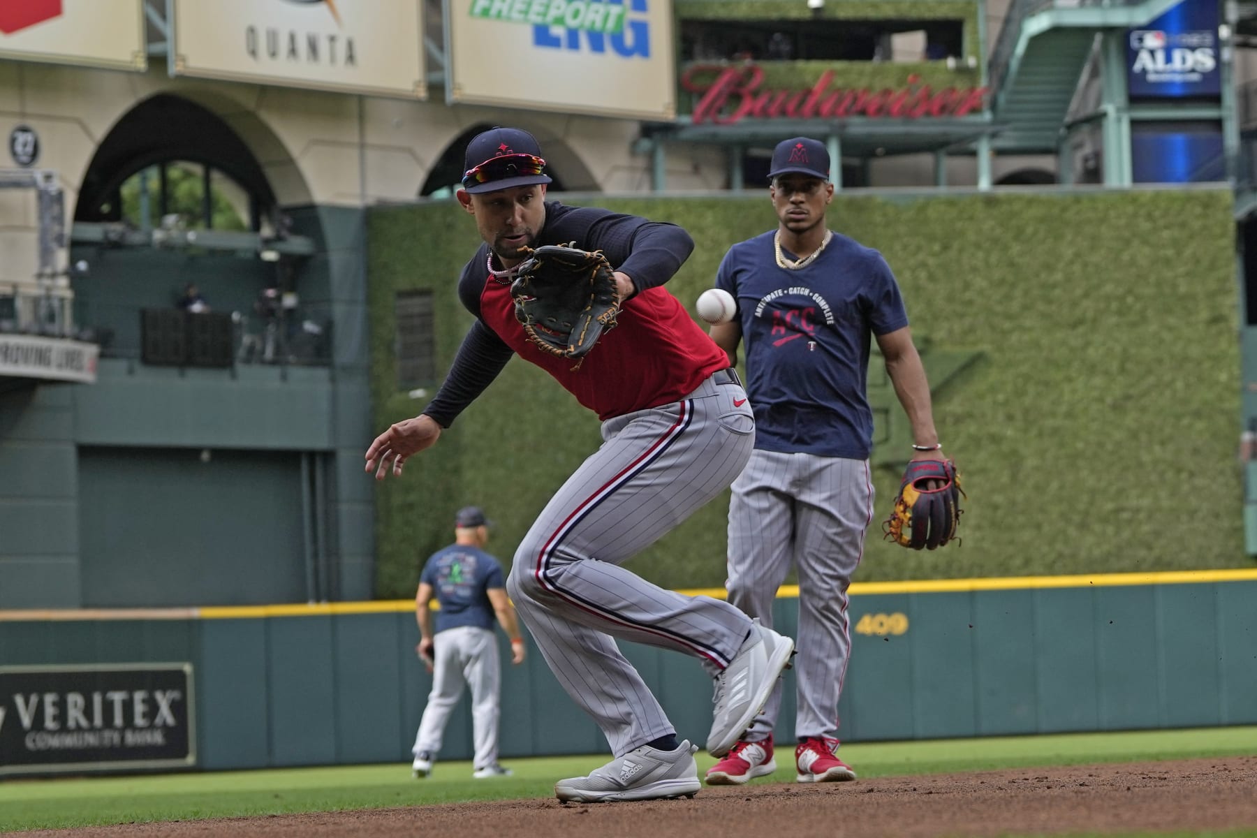 Minnesota Twins' Royce Lewis, front, fields a ground ball during an ALDS baseball workout Friday, Oct. 6, 2023, in Houston. The Twins will play the Houston Astros in Game 1 of an ALDS series Saturday. (AP Photo/David J. Phillip)