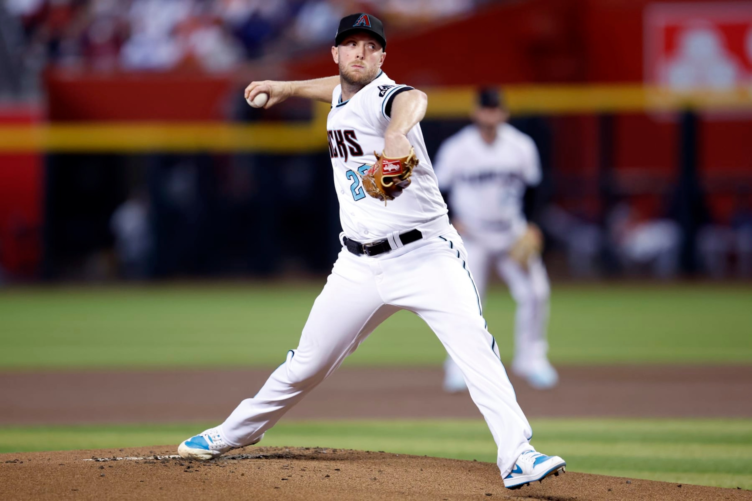 PHOENIX, ARIZONA - SEPTEMBER 30: Starter Merrill Kelly #29 of the Arizona Diamondbacks pitches against the Houston Astros during the first inning at Chase Field on September 30, 2023 in Phoenix, Arizona. (Photo by Chris Coduto/Getty Images)