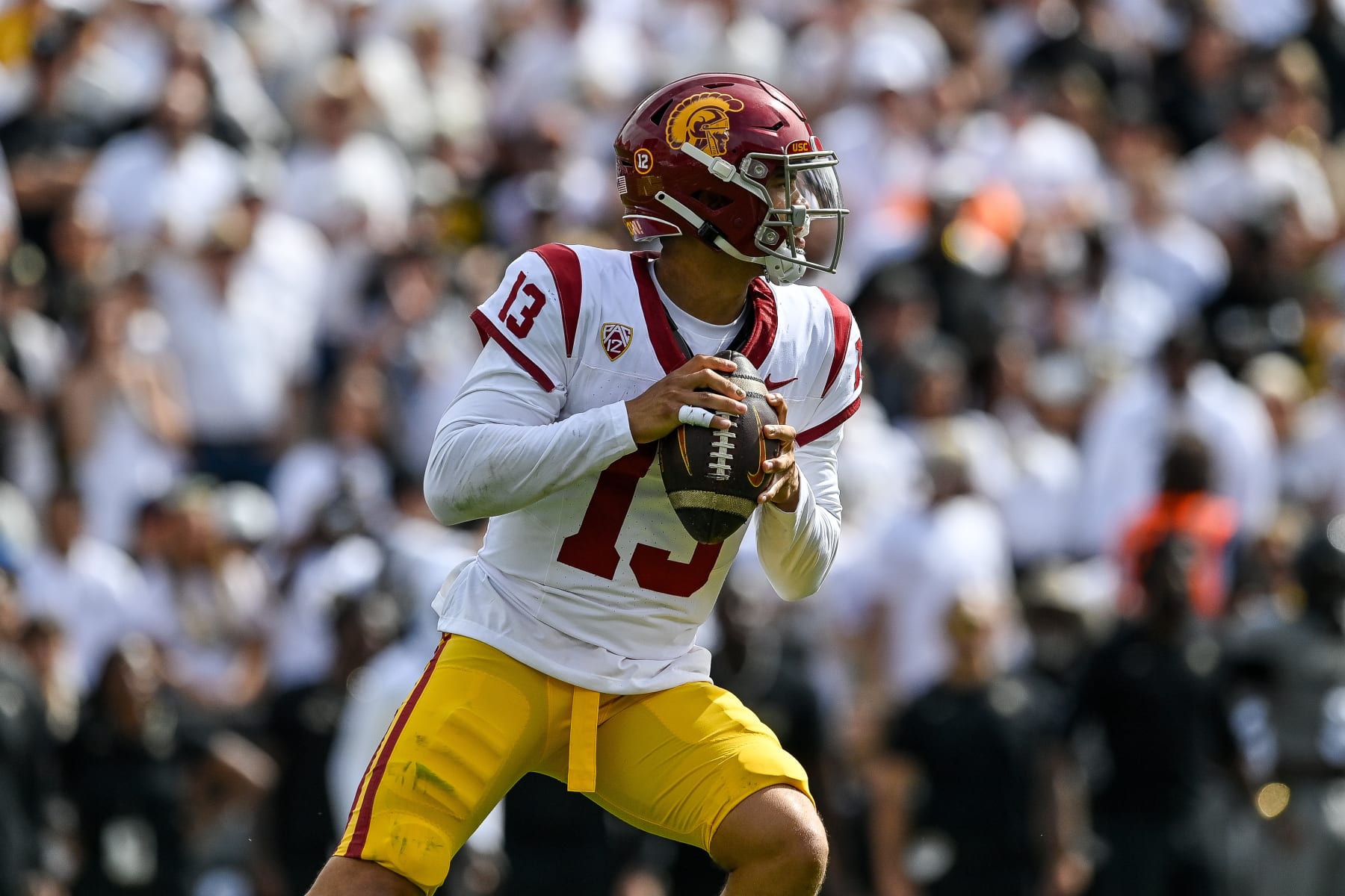 BOULDER, CO - SEPTEMBER 30:  Quarterback Caleb Williams #13 of the USC Trojans sets to pass against the Colorado Buffaloes in the third quarter at Folsom Field on September 30, 2023 in Boulder, Colorado. (Photo by Dustin Bradford/Getty Images)
