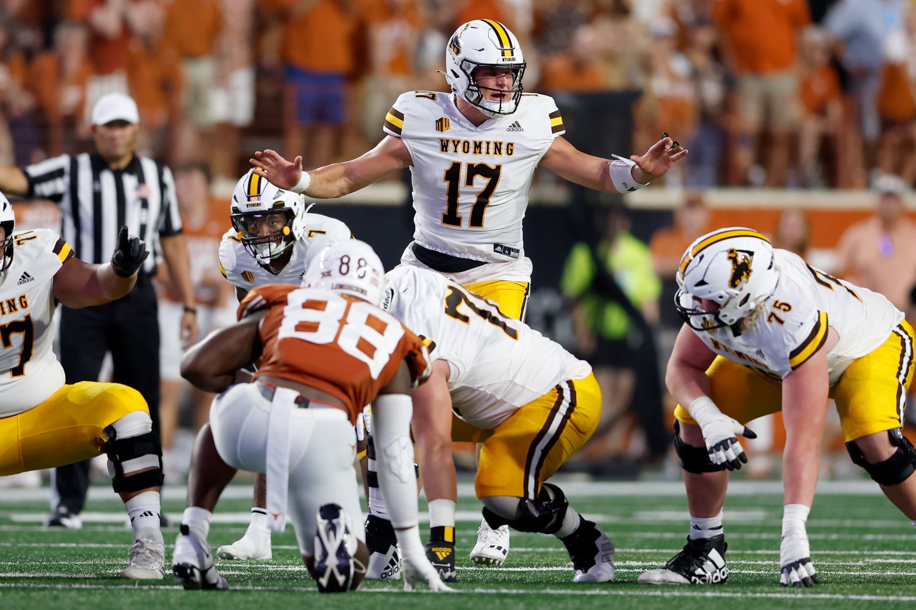 AUSTIN, TEXAS - SEPTEMBER 16: Evan Svoboda #17 of the Wyoming Cowboys signals at the line of scrimmage in the first half against the Texas Longhorns at Darrell K Royal-Texas Memorial Stadium on September 16, 2023 in Austin, Texas. (Photo by Tim Warner/Getty Images)