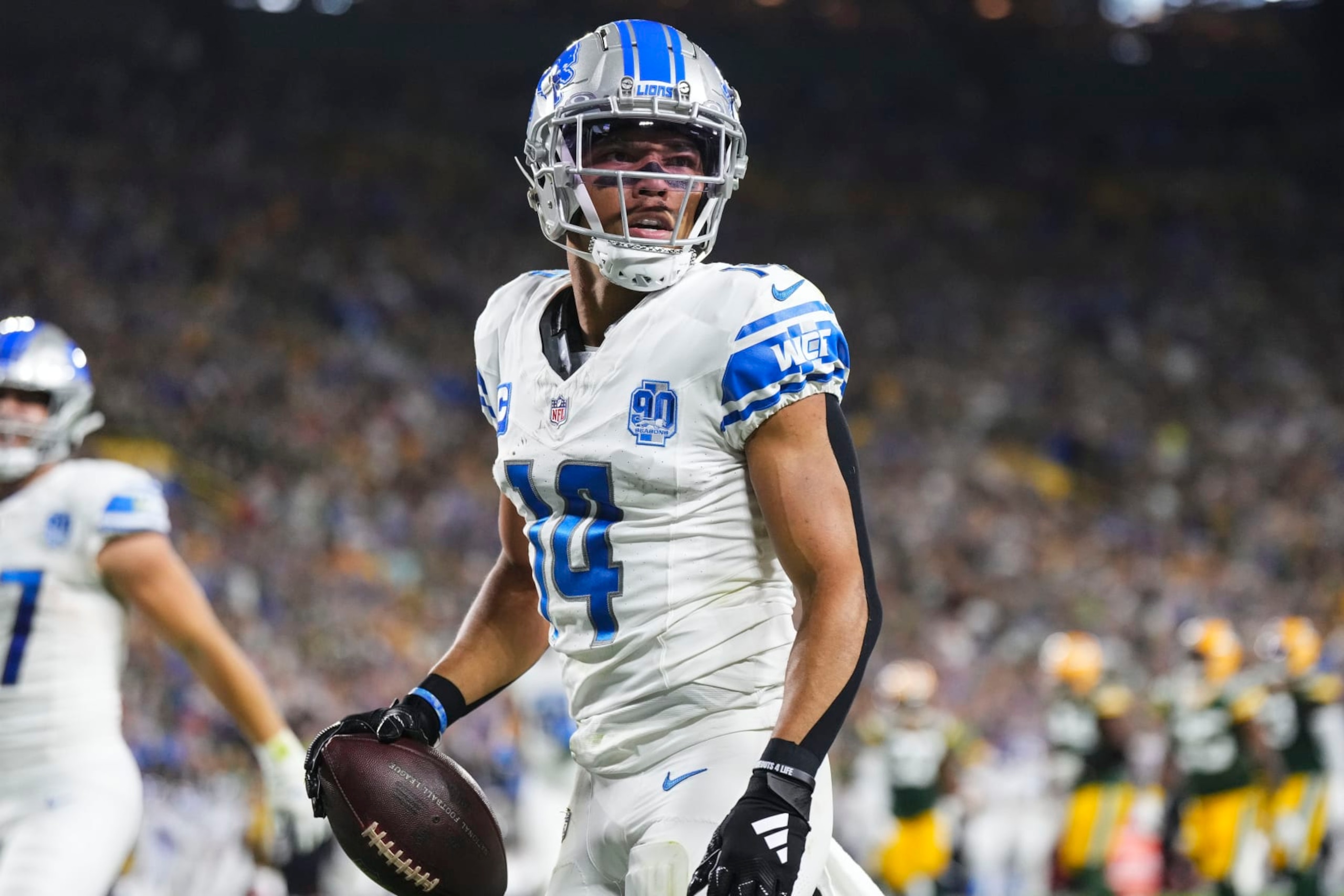 GREEN BAY, WI - SEPTEMBER 28: Amon-Ra St. Brown #14 of the Detroit Lions celebrates after scoring a touchdown during an NFL football game at Lambeau Field on September 28, 2023 in Green Bay, Wisconsin. (Photo by Cooper Neill/Getty Images)