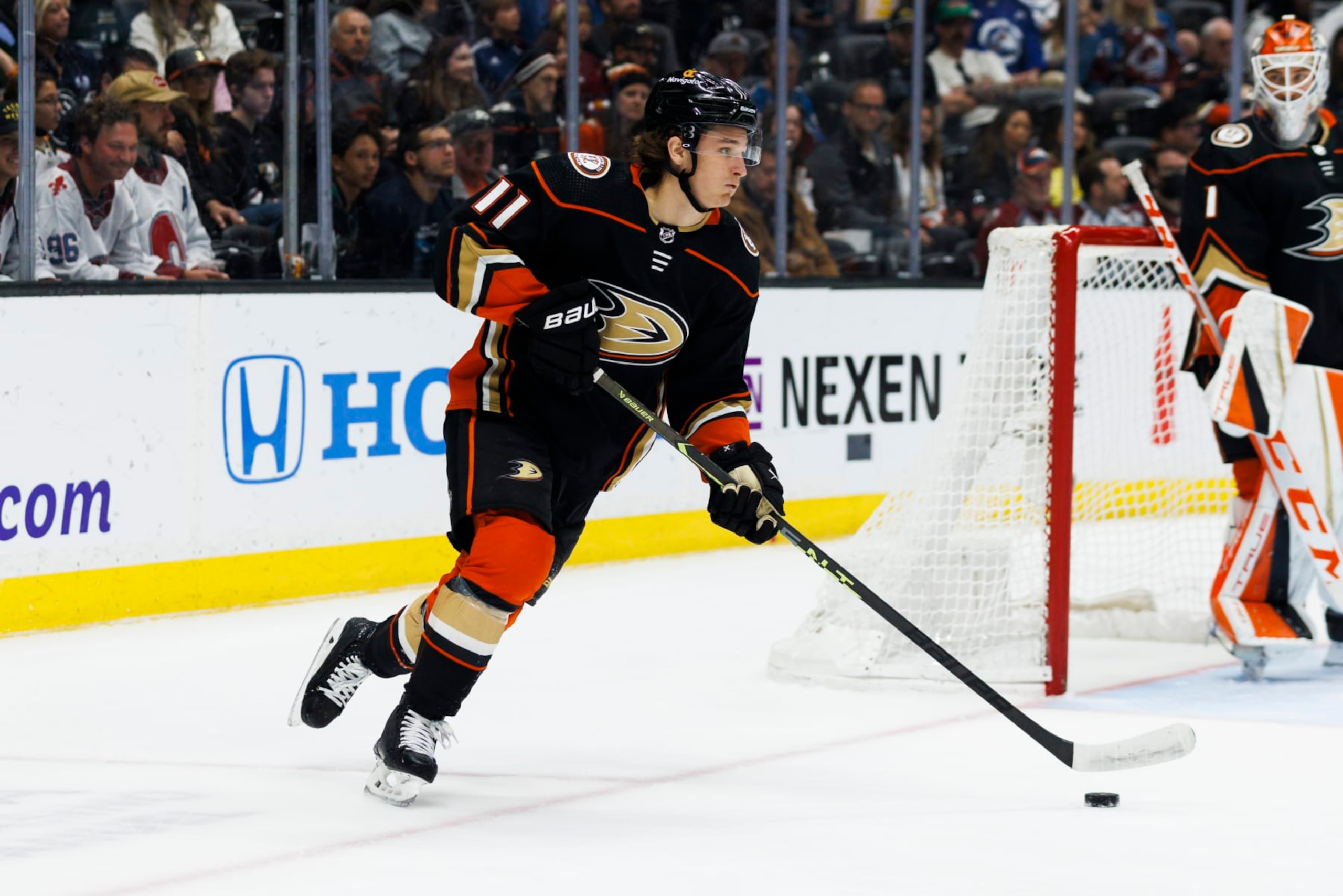 ANAHEIM, CA - APRIL 09: Anaheim Ducks center Trevor Zegras (11) skates with the puck during an NHL hockey game between the Colorado Avalanche and the Anaheim Ducks on April 9, 2023 at Honda Center in Anaheim, CA. (Photo by Ric Tapia/Icon Sportswire via Getty Images)