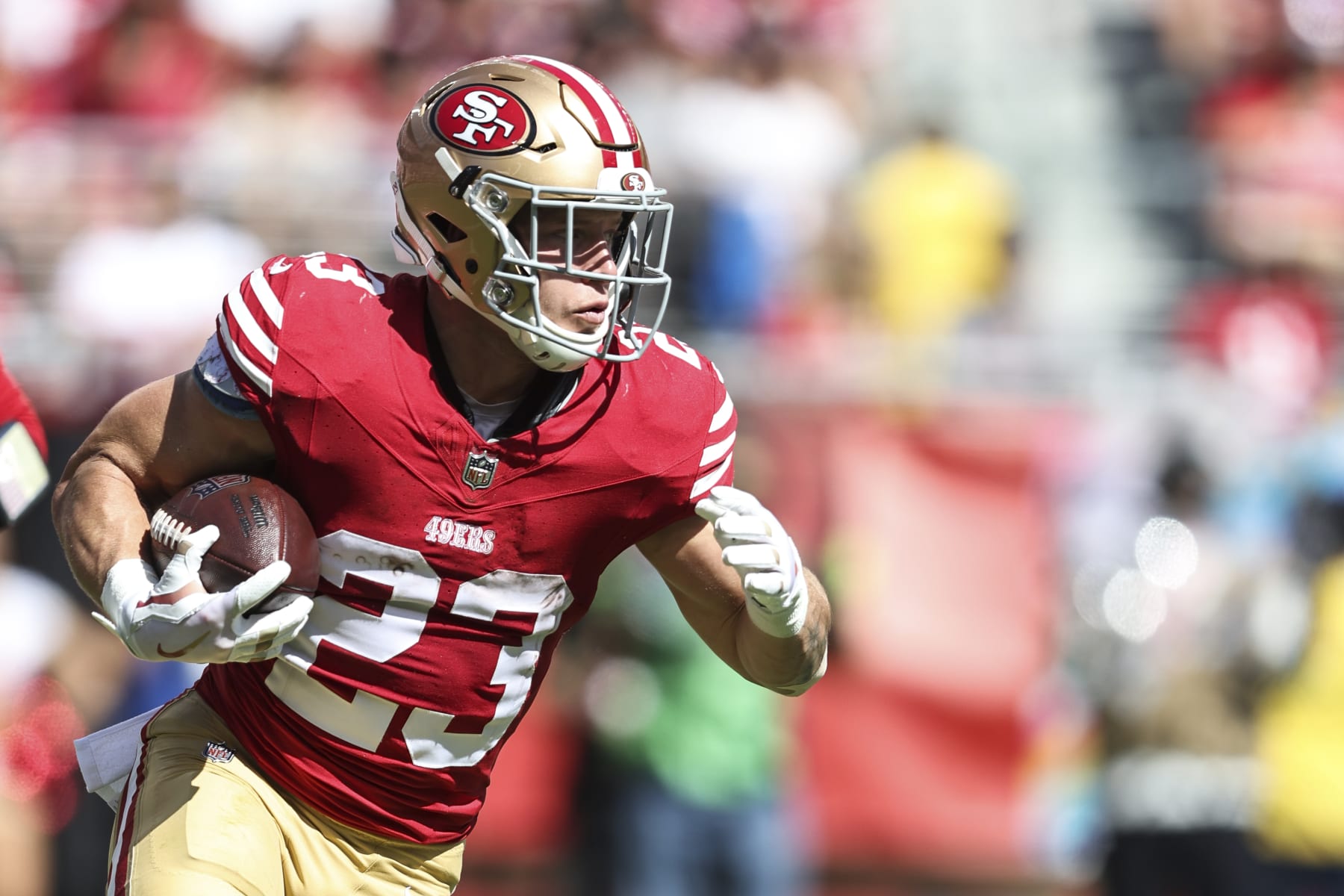 SANTA CLARA, CALIFORNIA - OCTOBER 01: Christian McCaffrey #23 of the San Francisco 49ers runs with the ball during an NFL football game between the San Francisco 49ers and the Arizona Cardinals at Levi's Stadium on October 01, 2023 in Santa Clara, California. (Photo by Michael Owens/Getty Images)