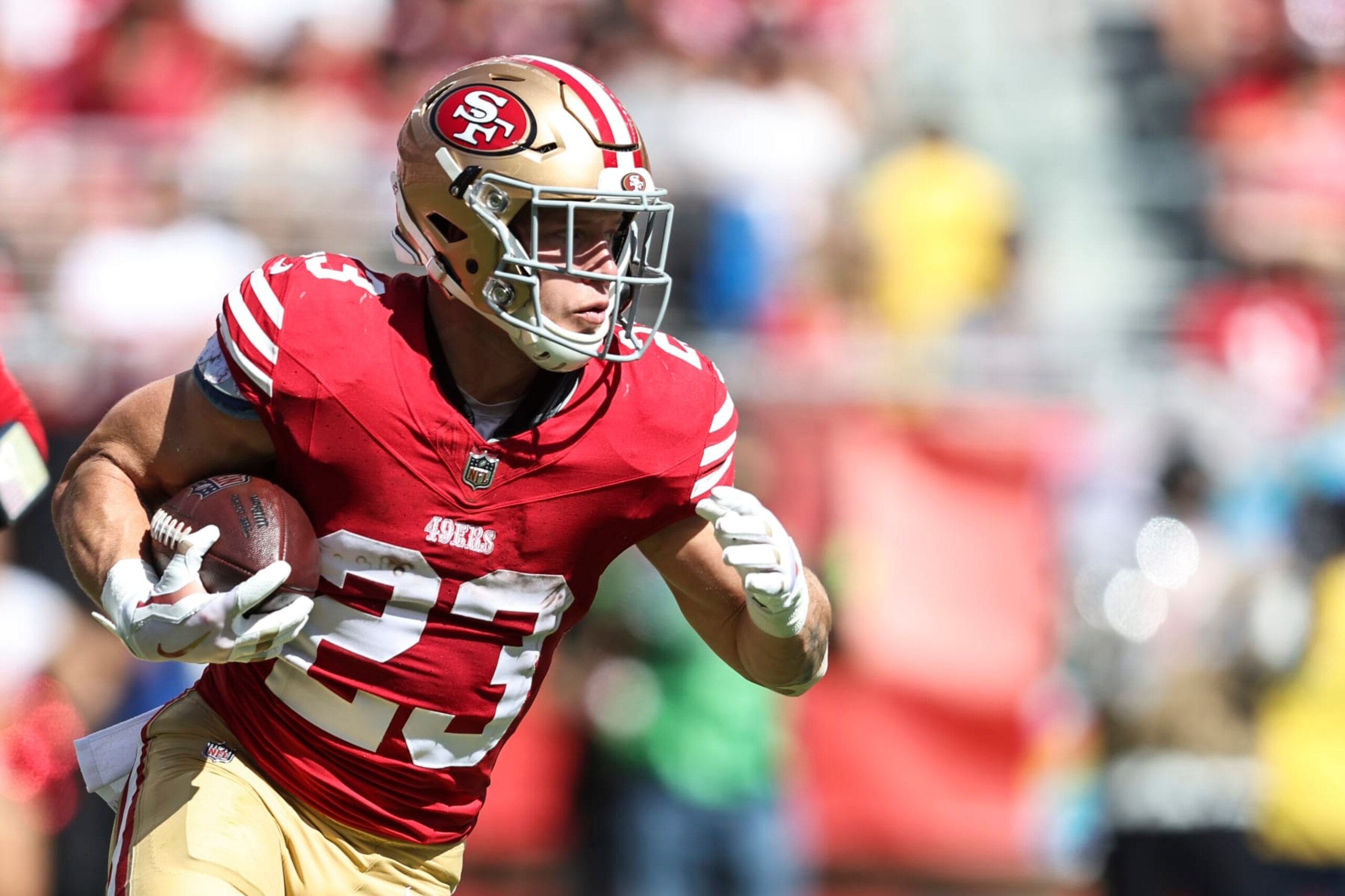 SANTA CLARA, CALIFORNIA - OCTOBER 01: Christian McCaffrey #23 of the San Francisco 49ers runs with the ball during an NFL football game between the San Francisco 49ers and the Arizona Cardinals at Levi's Stadium on October 01, 2023 in Santa Clara, California. (Photo by Michael Owens/Getty Images) SANTA CLARA, CALIFORNIA - OCTOBER 01: Christian McCaffrey #23 of the San Francisco 49ers runs with the ball during an NFL football game between the San Francisco 49ers and the Arizona Cardinals at Levi's Stadium on October 01, 2023 in Santa Clara, California. (Photo by Michael Owens/Getty Images)