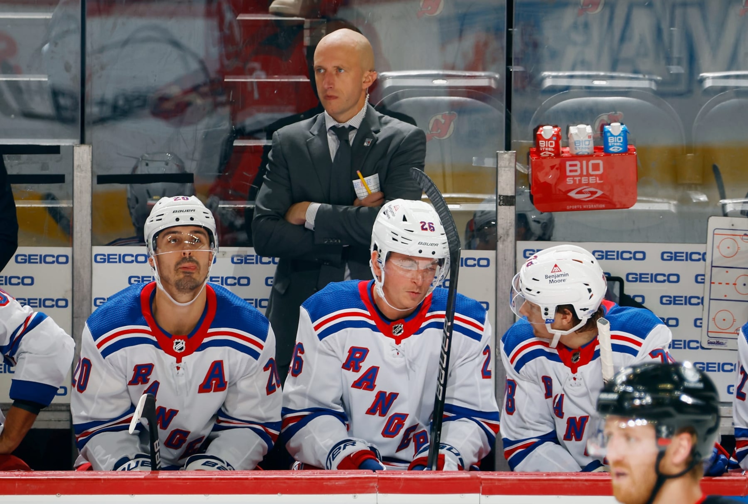 NEWARK, NEW JERSEY - OCTOBER 04: Assistant coach Dan Muse of the New York Rangers handles the bench during the game against the New Jersey Devils at Prudential Center on October 04, 2023 in Newark, New Jersey. (Photo by Bruce Bennett/Getty Images)