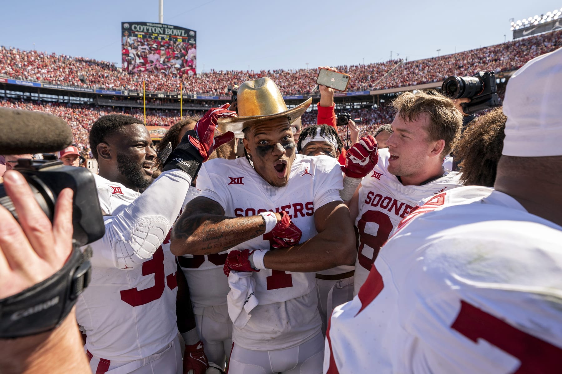 Oklahoma wide receiver Jayden Gibson (1) celebrates with the Golden Hat after defeating Texas 34-30 in an NCAA college football game at the Cotton Bowl, Saturday, Oct. 7, 2023, in Dallas. (AP Photo/Jeffrey McWhorter)