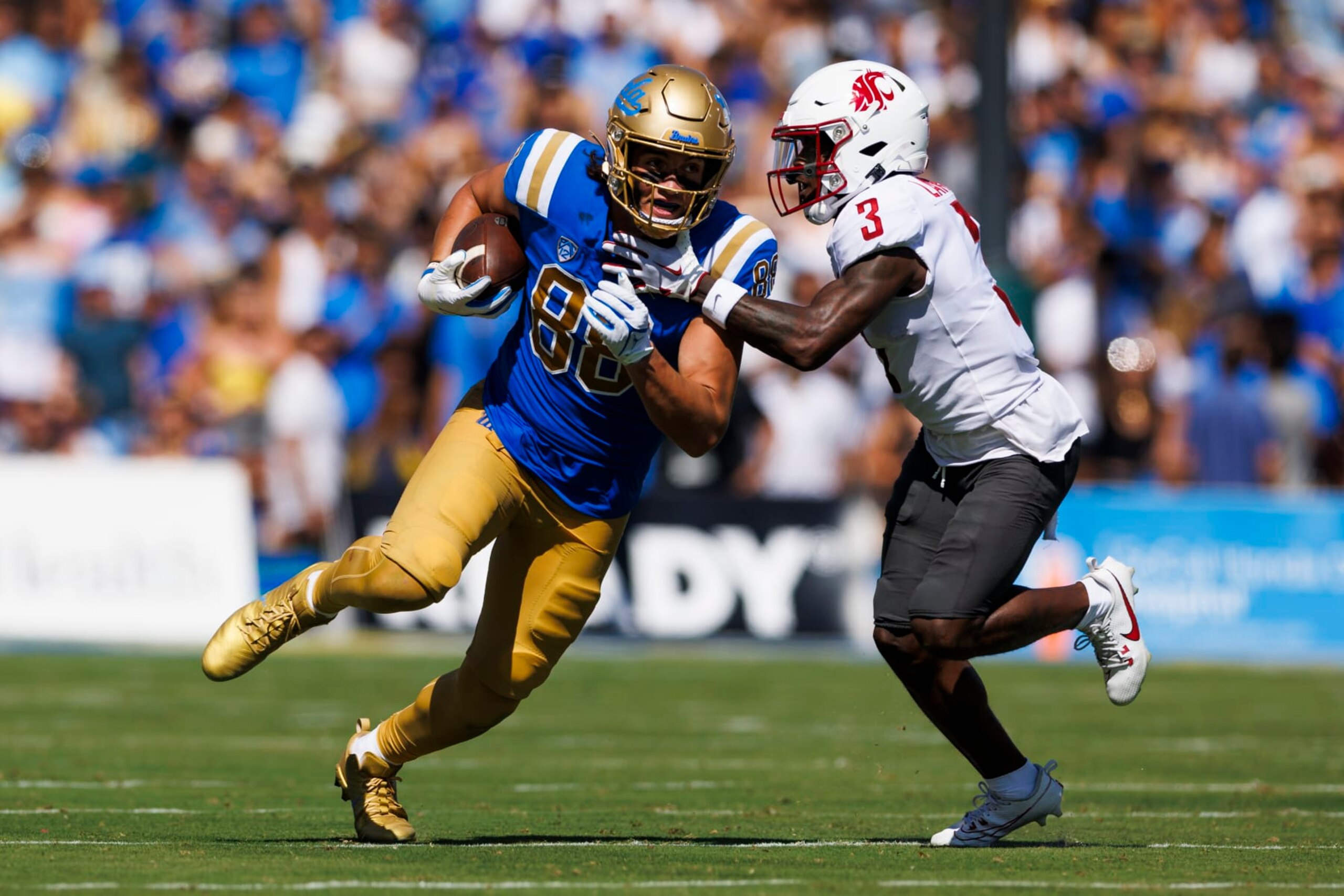 PASADENA, CA - OCTOBER 07: UCLA Bruins tight end Moliki Matavao (88) runs after the catch against Washington State Cougars defensive back Cam Lampkin (3) during the college football game on October 7, 2023 at Rose Bowl Stadium in Pasadena, CA. (Photo by Ric Tapia/Icon Sportswire via Getty Images)