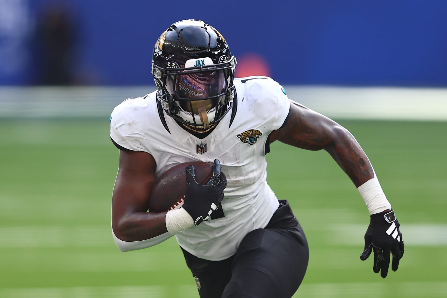 LONDON, ENGLAND - OCTOBER 08: Travis Etienne Jr. #1 of the Jacksonville Jaguars runs with the ball in the second quarter during the NFL Match between Jacksonville Jaguars and Buffalo Bills at Tottenham Hotspur Stadium on October 08, 2023 in London, England. (Photo by Peter Nicholls/Getty Images)