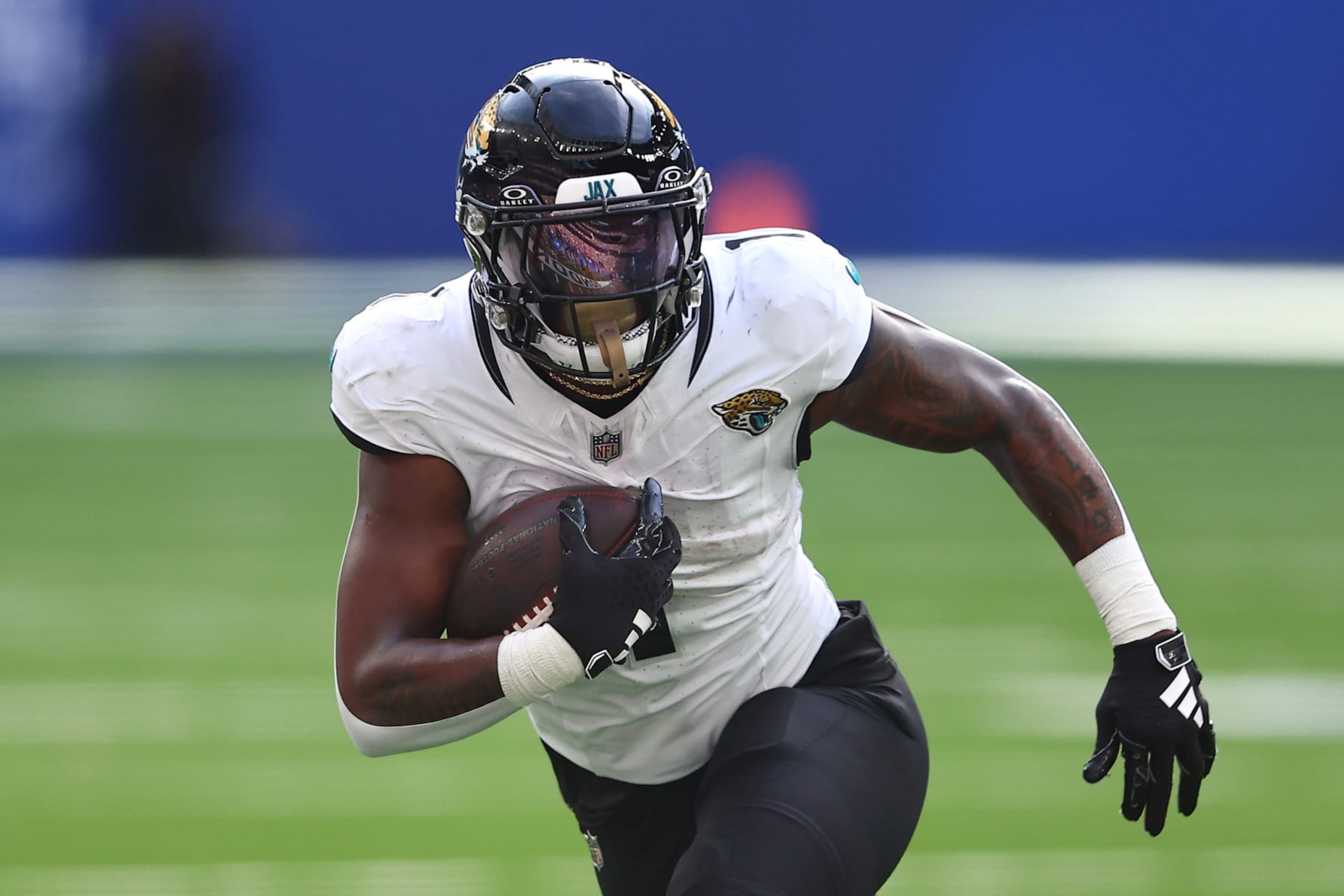 LONDON, ENGLAND - OCTOBER 08: Travis Etienne Jr. #1 of the Jacksonville Jaguars runs with the ball in the second quarter during the NFL Match between Jacksonville Jaguars and Buffalo Bills at Tottenham Hotspur Stadium on October 08, 2023 in London, England. (Photo by Peter Nicholls/Getty Images)