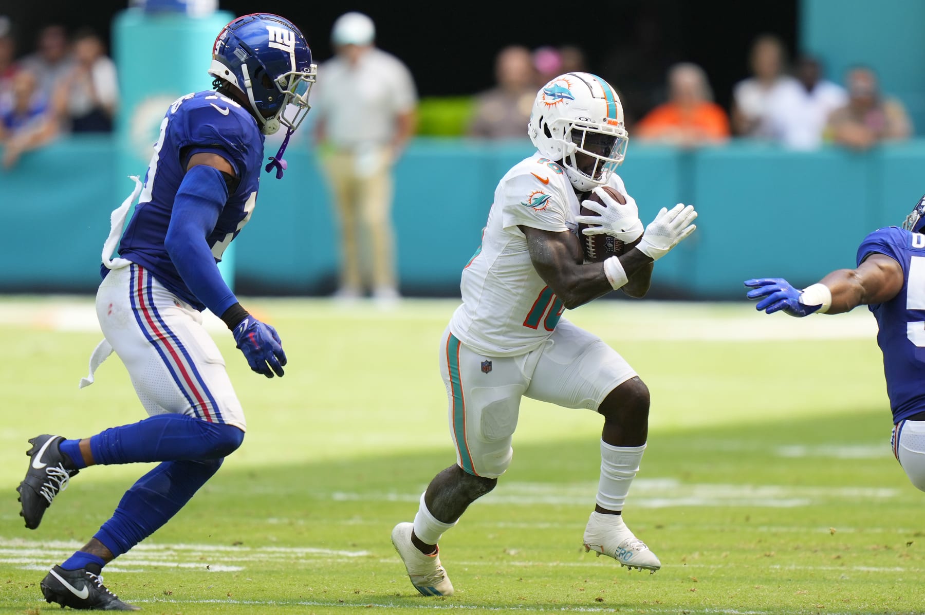 MIAMI GARDENS, FLORIDA - OCTOBER 08: Tyreek Hill #10 of the Miami Dolphins runs the ball against the New York Giants during the second quarter at Hard Rock Stadium on October 08, 2023 in Miami Gardens, Florida. (Photo by Rich Storry/Getty Images)