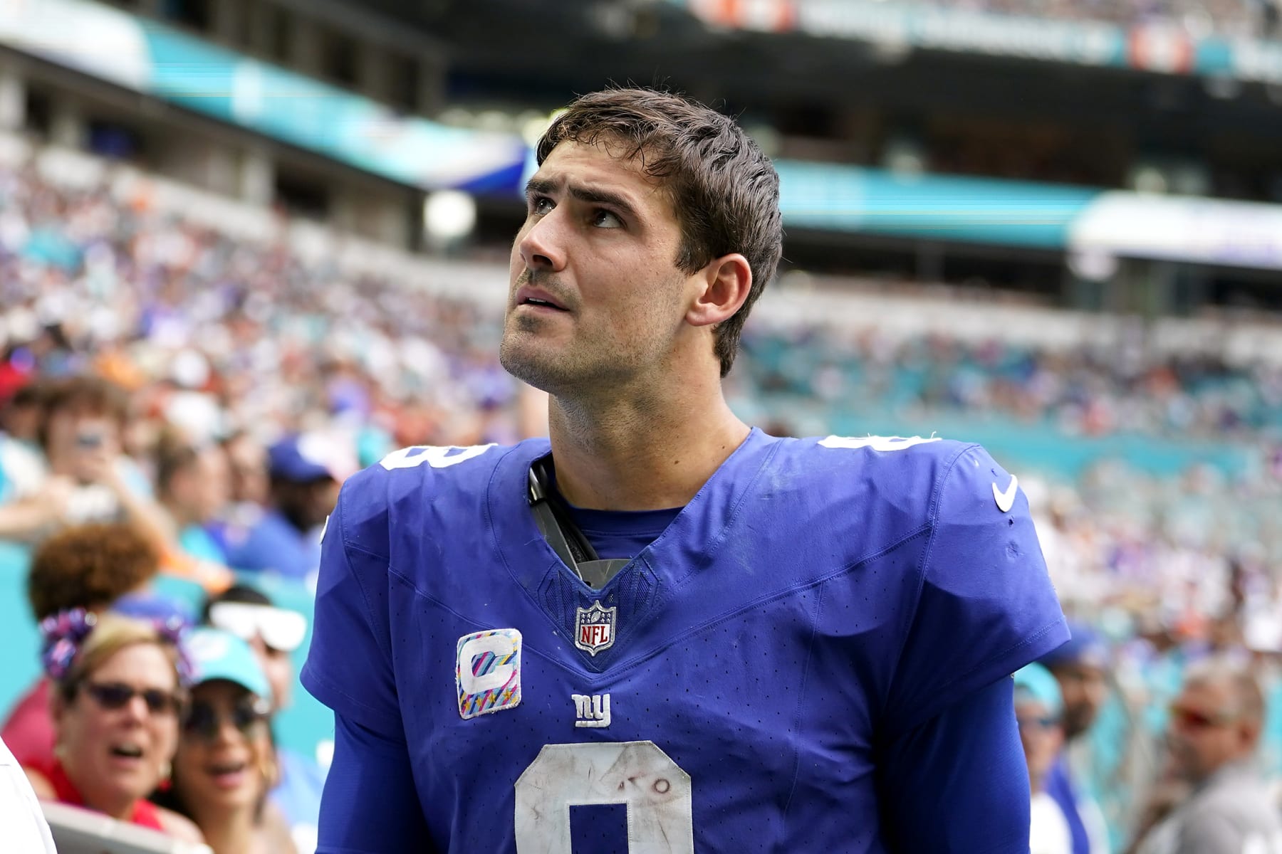 MIAMI GARDENS, FLORIDA - OCTOBER 08: Daniel Jones #8 of the New York Giants leaves the field after an injury against the Miami Dolphins during the fourth quarter at Hard Rock Stadium on October 08, 2023 in Miami Gardens, Florida. (Photo by Rich Storry/Getty Images)