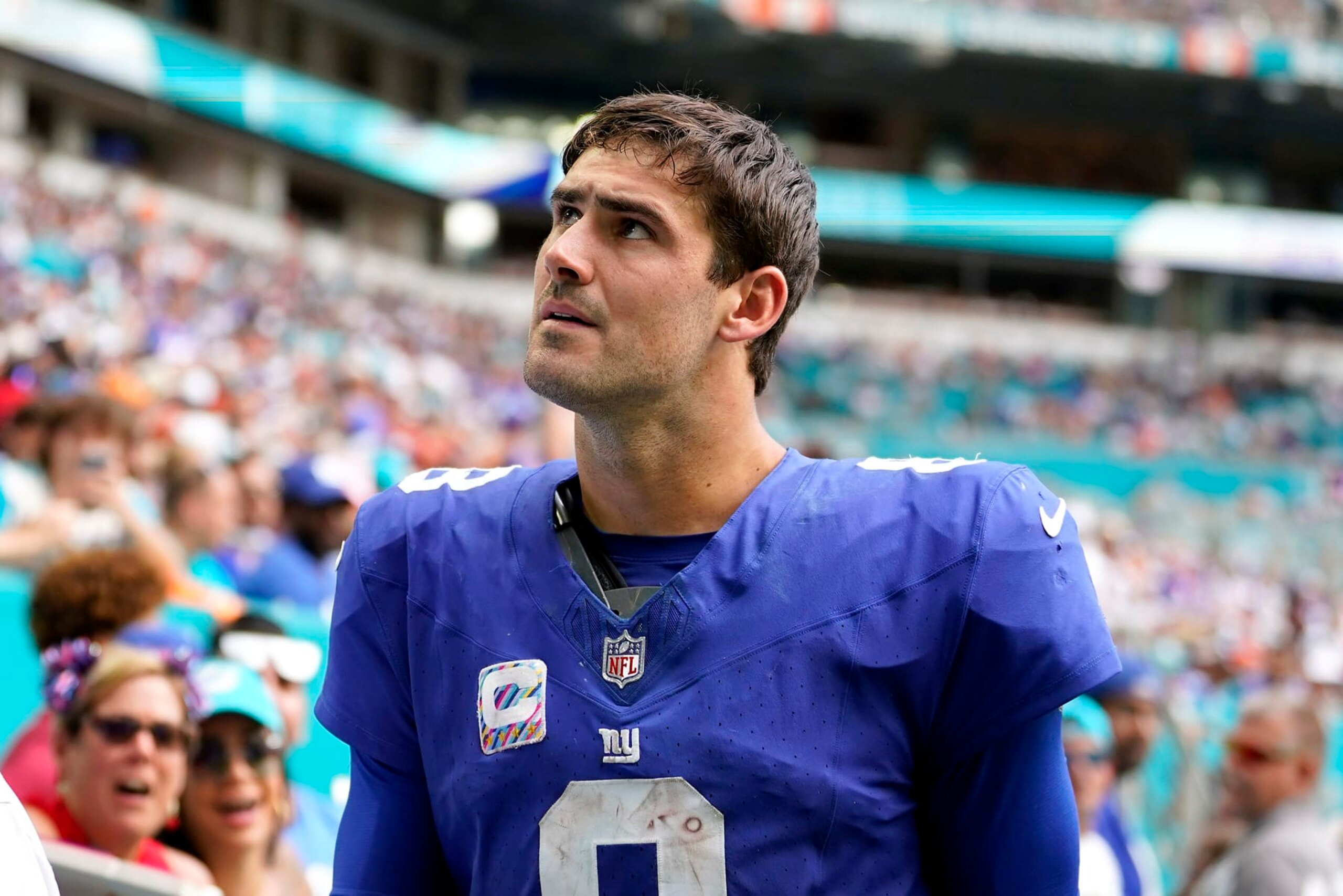 MIAMI GARDENS, FLORIDA - OCTOBER 08: Daniel Jones #8 of the New York Giants leaves the field after an injury against the Miami Dolphins during the fourth quarter at Hard Rock Stadium on October 08, 2023 in Miami Gardens, Florida. (Photo by Rich Storry/Getty Images)