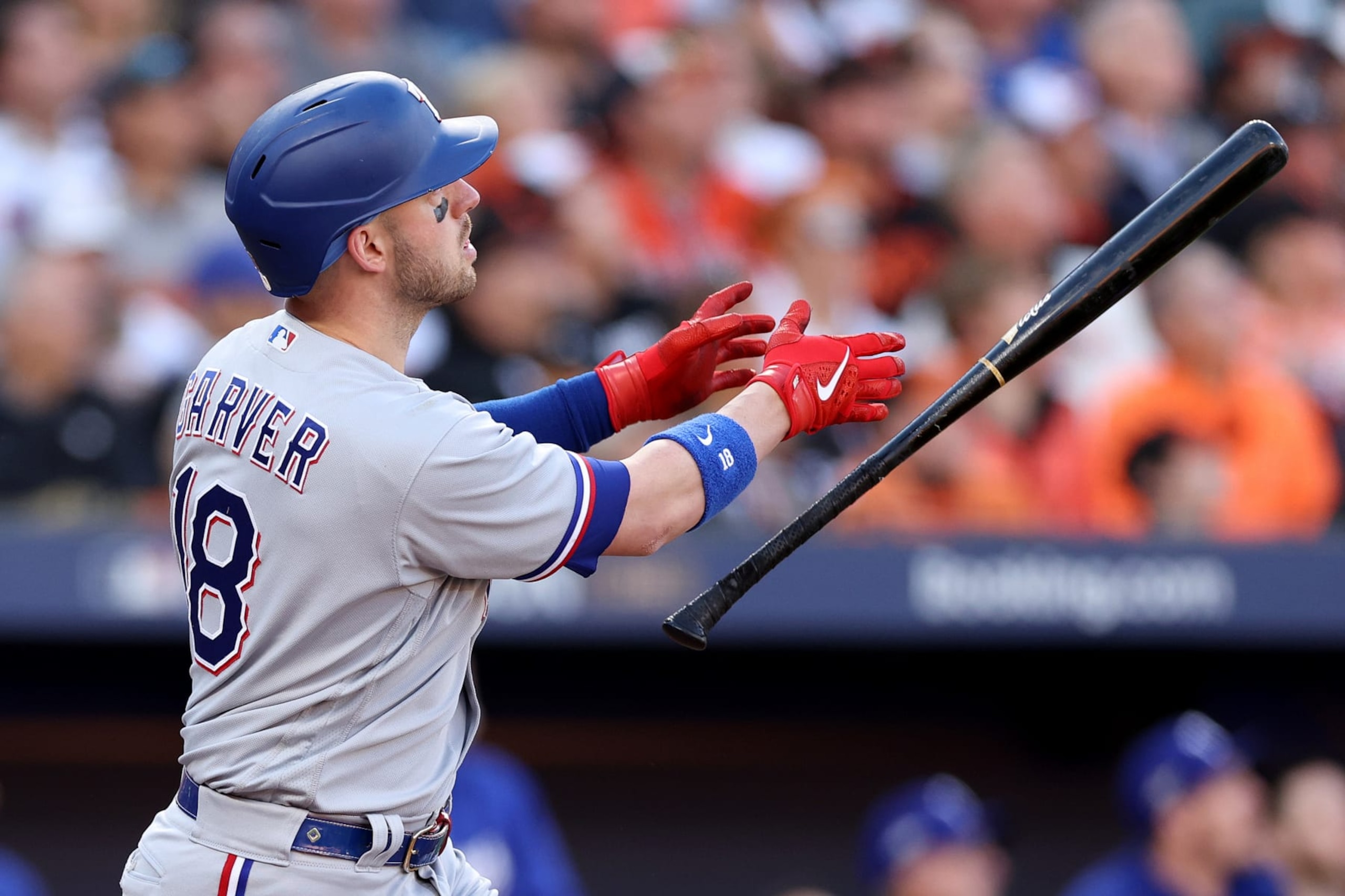 BALTIMORE, MARYLAND - OCTOBER 08: Mitch Garver #18 of the Texas Rangers watches his grand slam against the Baltimore Orioles during the third inning in Game Two of the Division Series at Oriole Park at Camden Yards on October 08, 2023 in Baltimore, Maryland. (Photo by Patrick Smith/Getty Images)