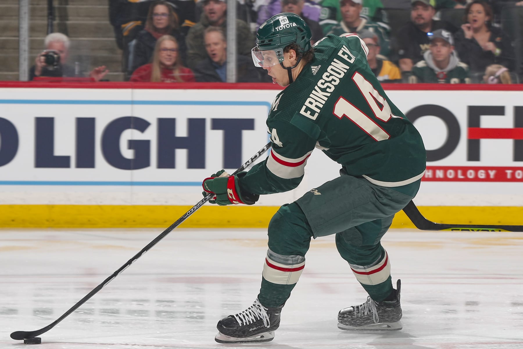 SAINT PAUL, MN - MARCH 18: Joel Eriksson Ek #14 of the Minnesota Wild skates with the puck against the Boston Bruins during the game at the Xcel Energy Center on March 18, 2023 in Saint Paul, Minnesota. (Photo by Bruce Kluckhohn/NHLI via Getty Images)