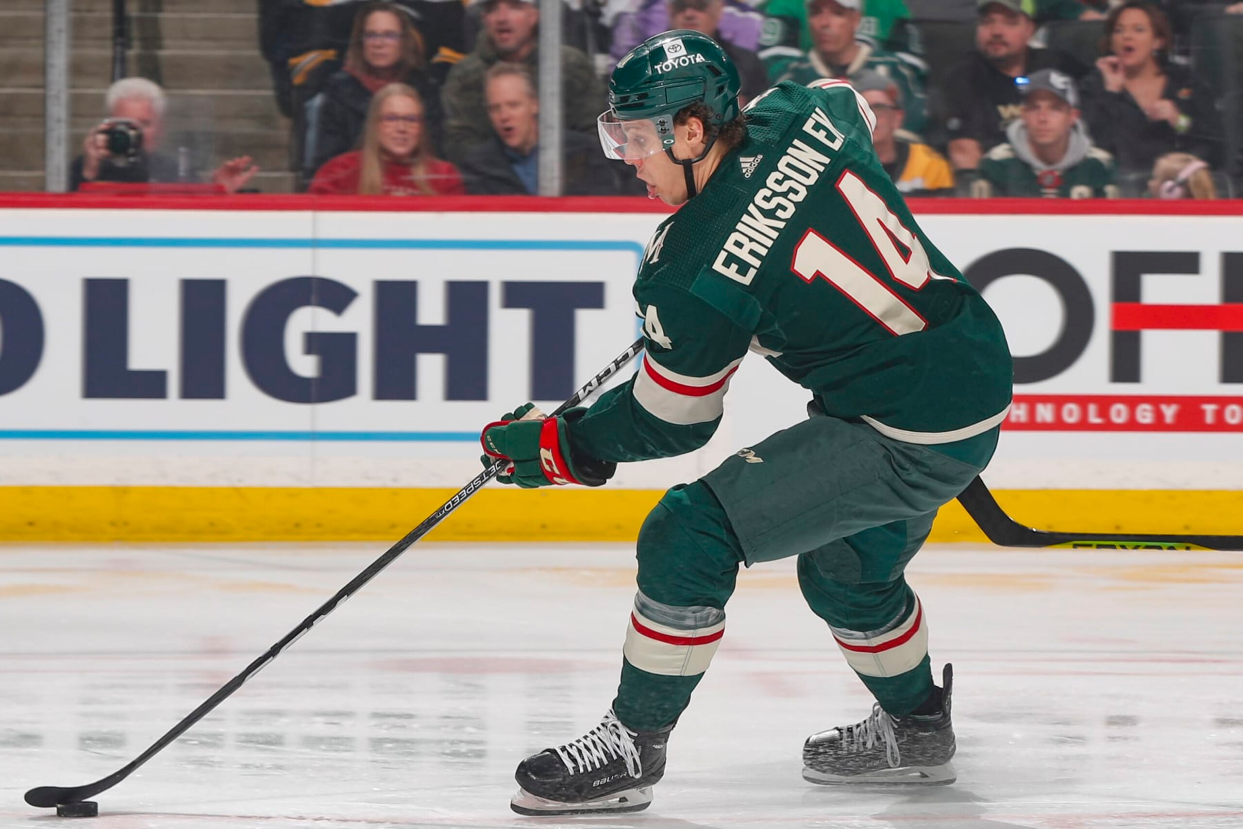 SAINT PAUL, MN - MARCH 18: Joel Eriksson Ek #14 of the Minnesota Wild skates with the puck against the Boston Bruins during the game at the Xcel Energy Center on March 18, 2023 in Saint Paul, Minnesota. (Photo by Bruce Kluckhohn/NHLI via Getty Images)