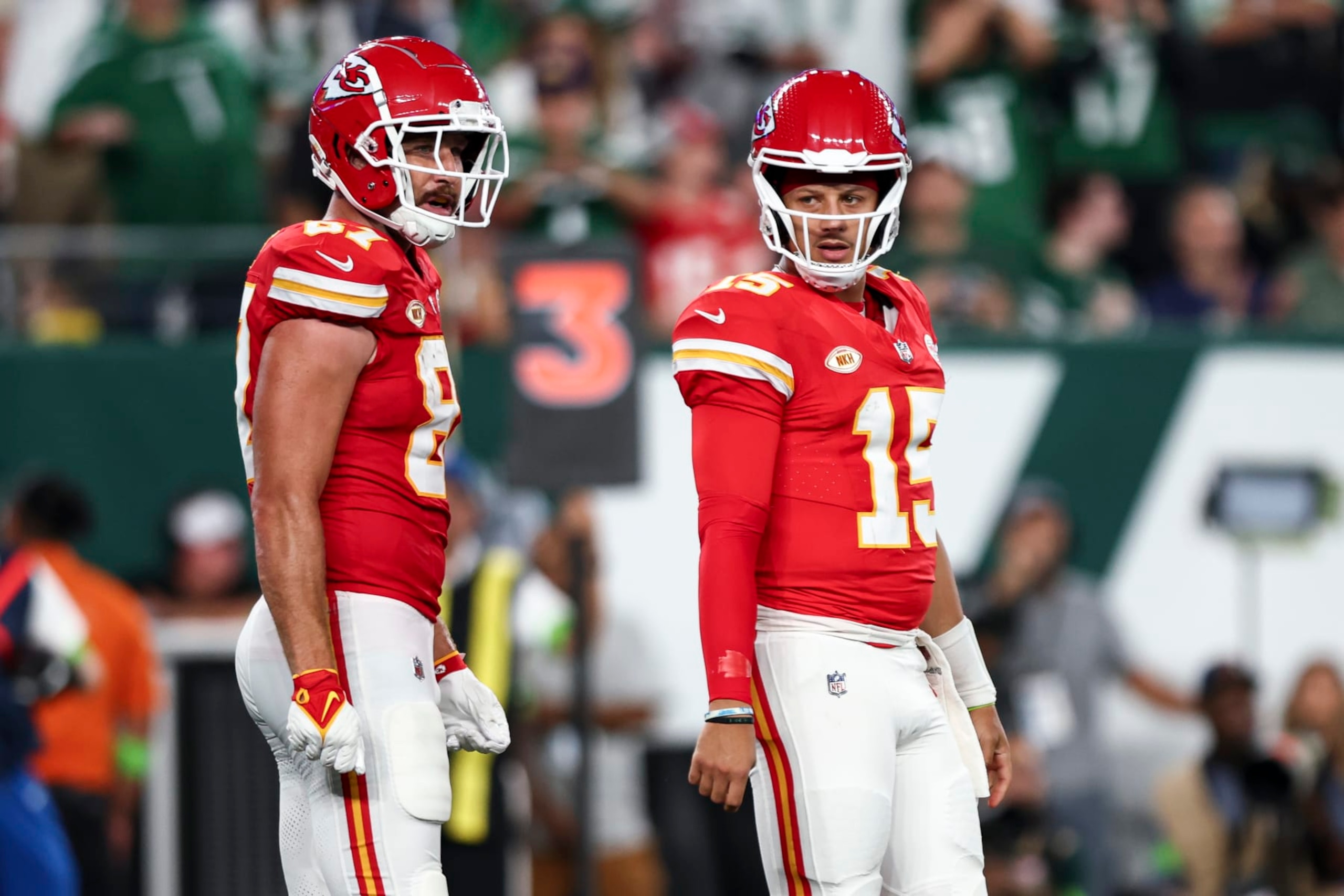 EAST RUTHERFORD, NJ - OCTOBER 1: Patrick Mahomes #15 of the Kansas City Chiefs stands on the field with Travis Kelce #87 during an NFL football game against the New York Jets at MetLife Stadium on October 1, 2023 in East Rutherford, New Jersey. (Photo by Kevin Sabitus/Getty Images)