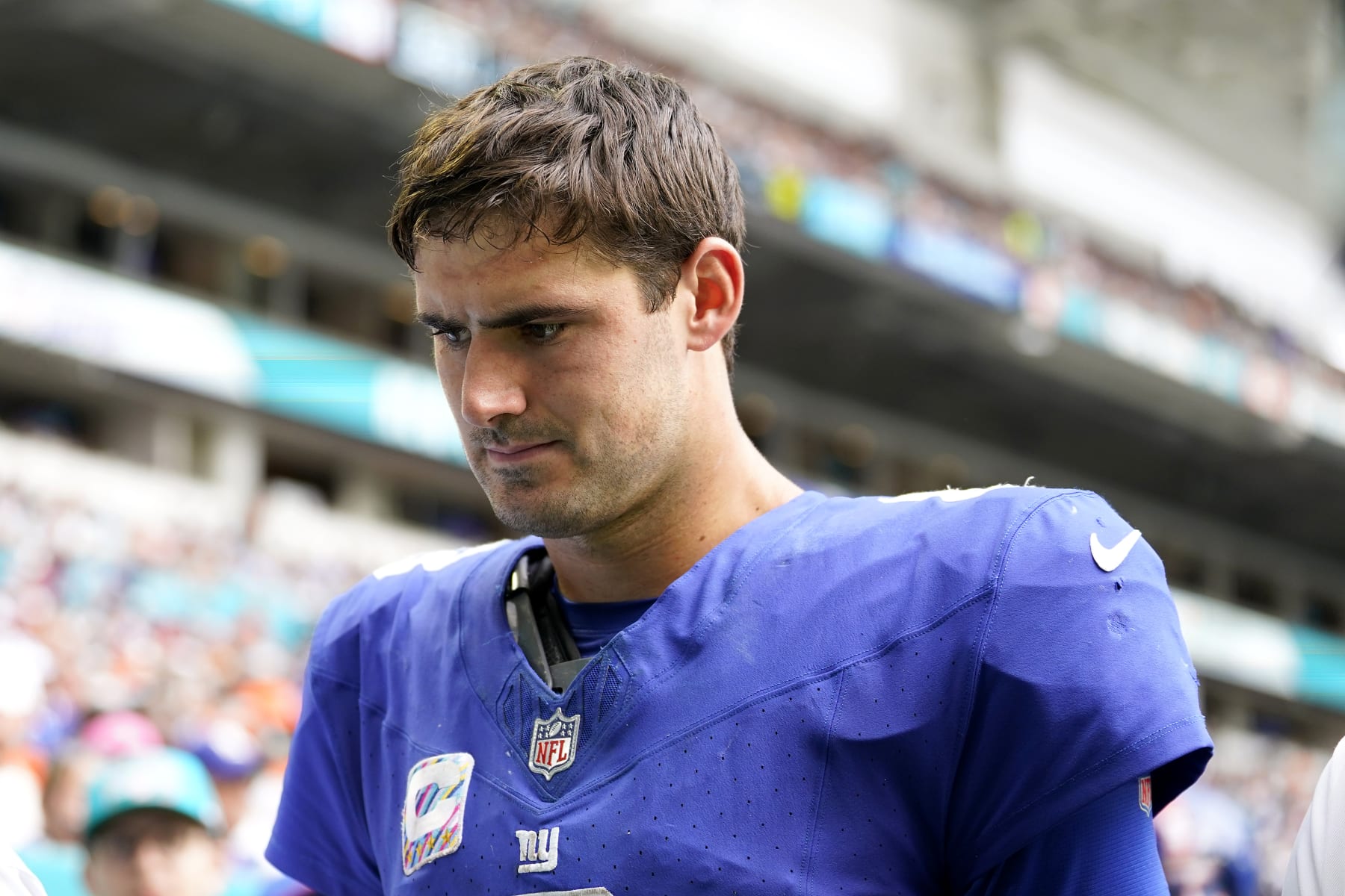 MIAMI GARDENS, FLORIDA - OCTOBER 08: Daniel Jones #8 of the New York Giants leaves the field after an injury against the Miami Dolphins during the fourth quarter at Hard Rock Stadium on October 08, 2023 in Miami Gardens, Florida. (Photo by Rich Storry/Getty Images)