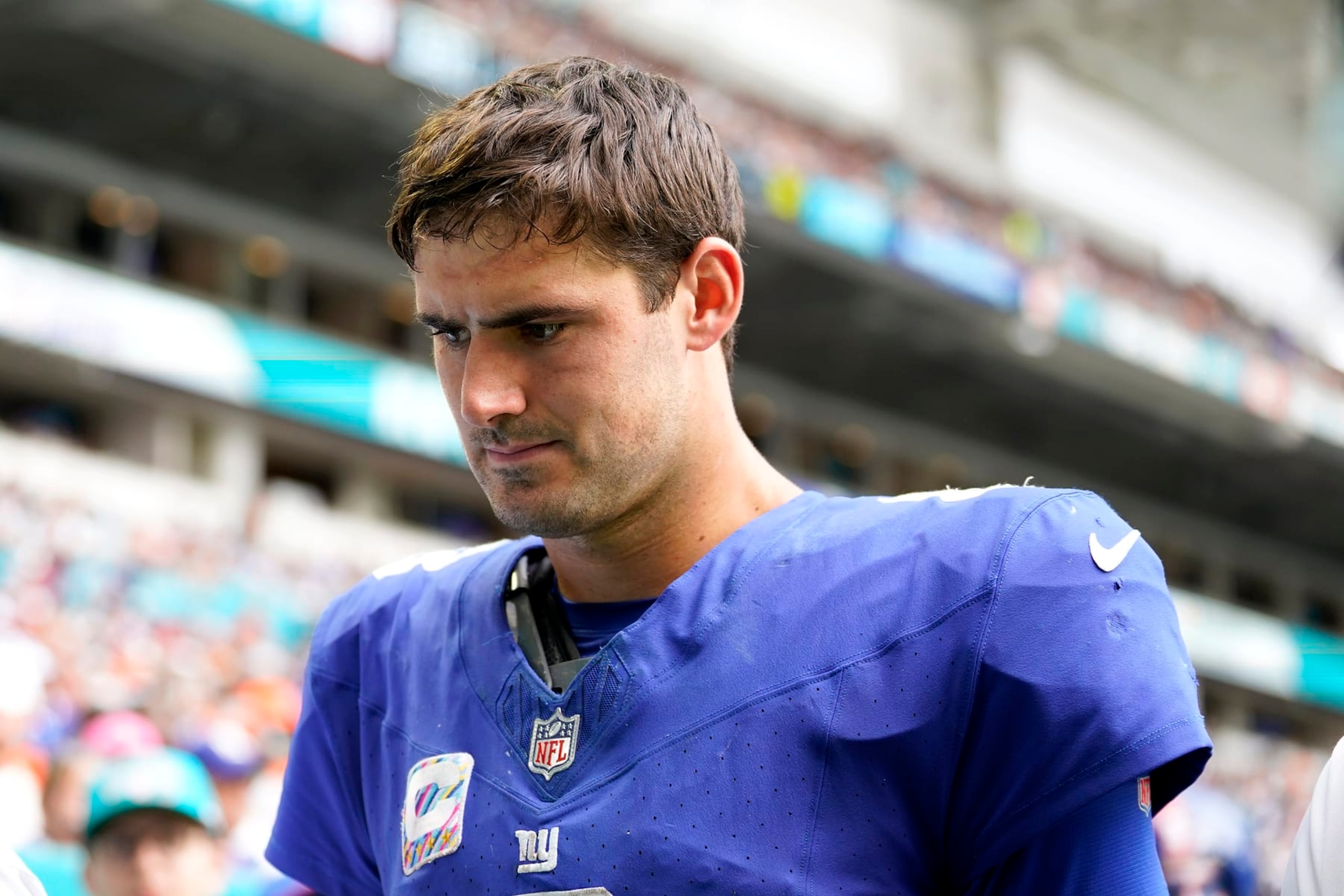 MIAMI GARDENS, FLORIDA - OCTOBER 08: Daniel Jones #8 of the New York Giants leaves the field after an injury against the Miami Dolphins during the fourth quarter at Hard Rock Stadium on October 08, 2023 in Miami Gardens, Florida. (Photo by Rich Storry/Getty Images)