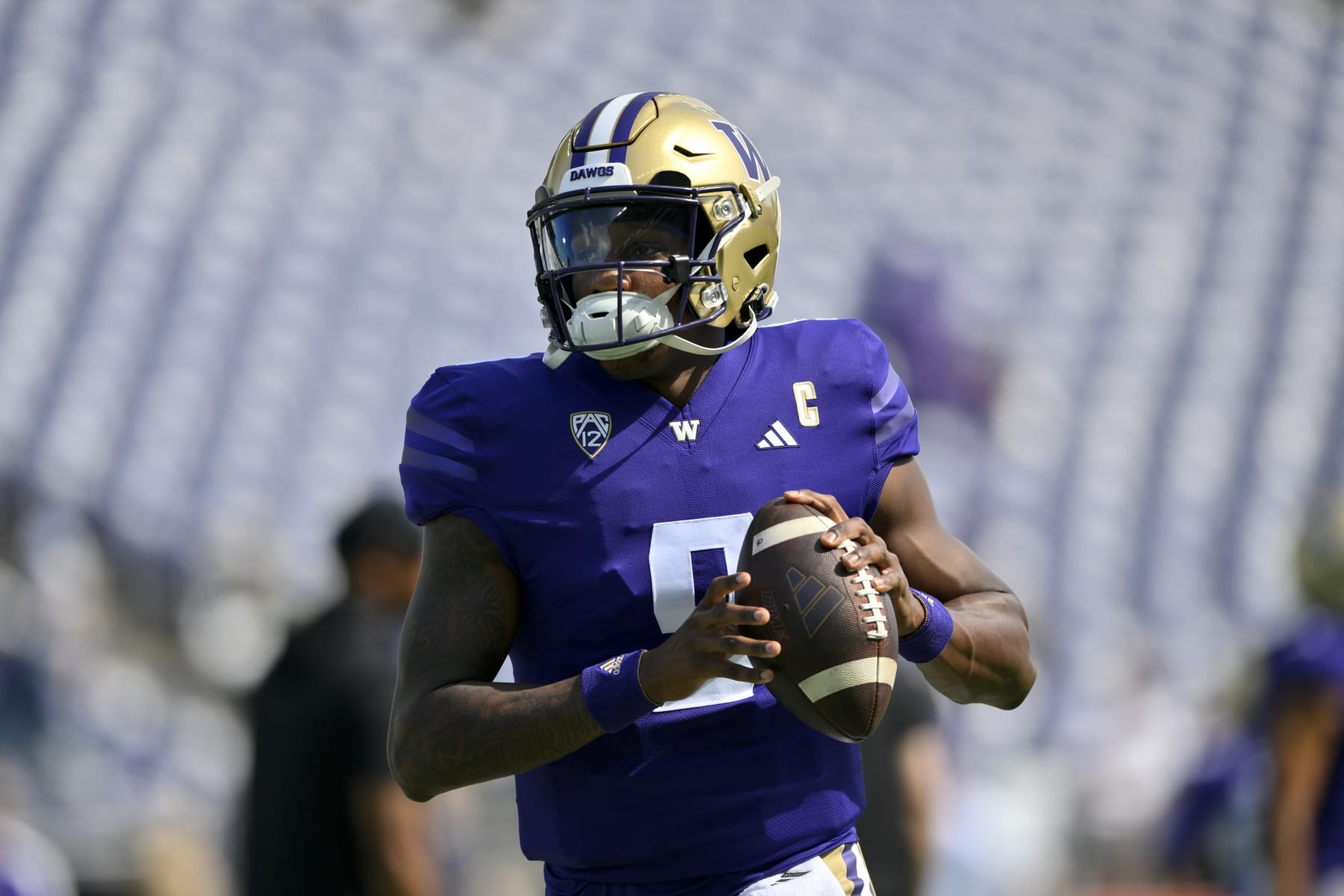 SEATTLE, WASHINGTON - SEPTEMBER 02: Michael Penix Jr. #9 of the Washington Huskies warms up before the game against the Boise State Broncos at Husky Stadium on September 02, 2023 in Seattle, Washington. (Photo by Alika Jenner/Getty Images)