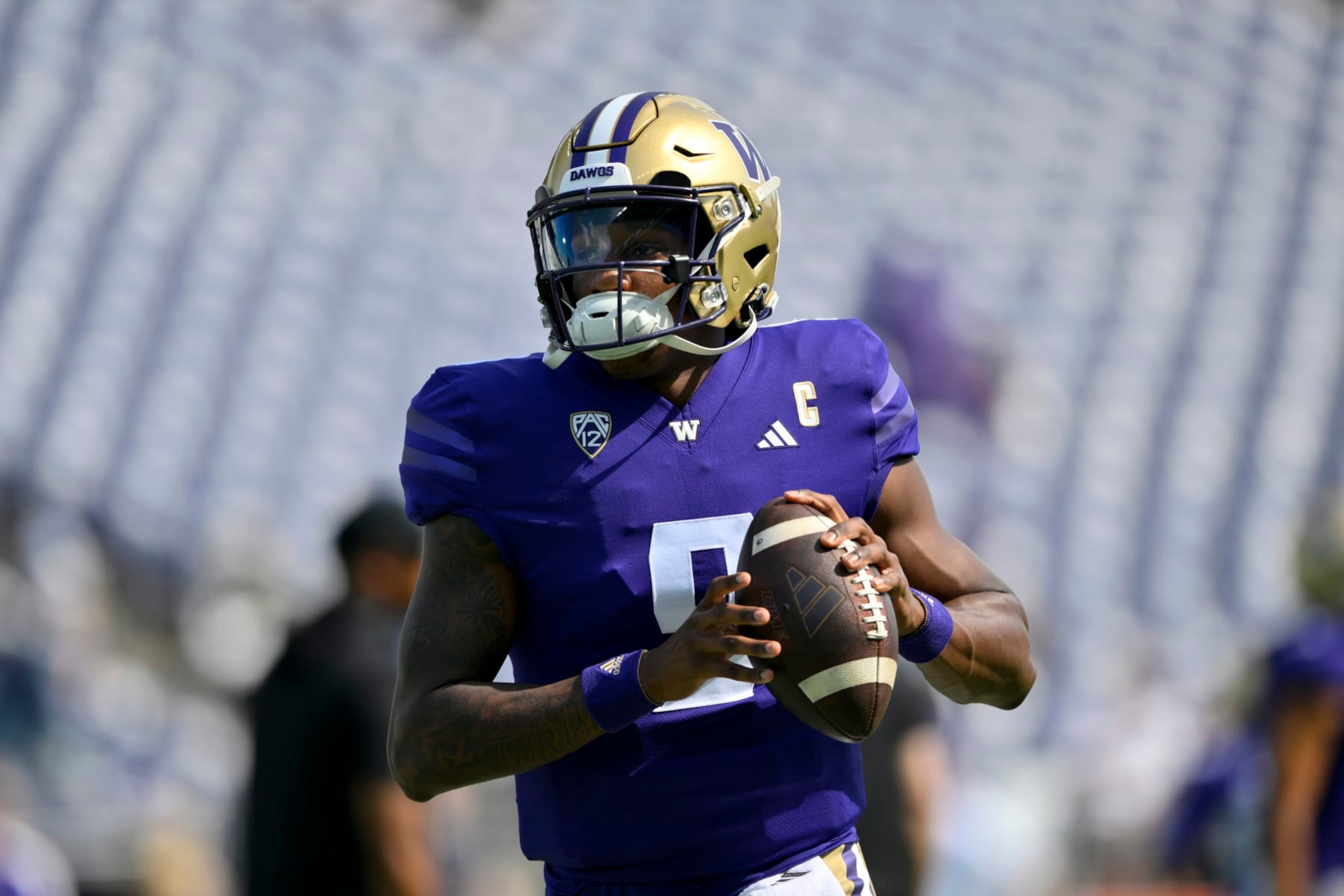 SEATTLE, WASHINGTON - SEPTEMBER 02: Michael Penix Jr. #9 of the Washington Huskies warms up before the game against the Boise State Broncos at Husky Stadium on September 02, 2023 in Seattle, Washington. (Photo by Alika Jenner/Getty Images)