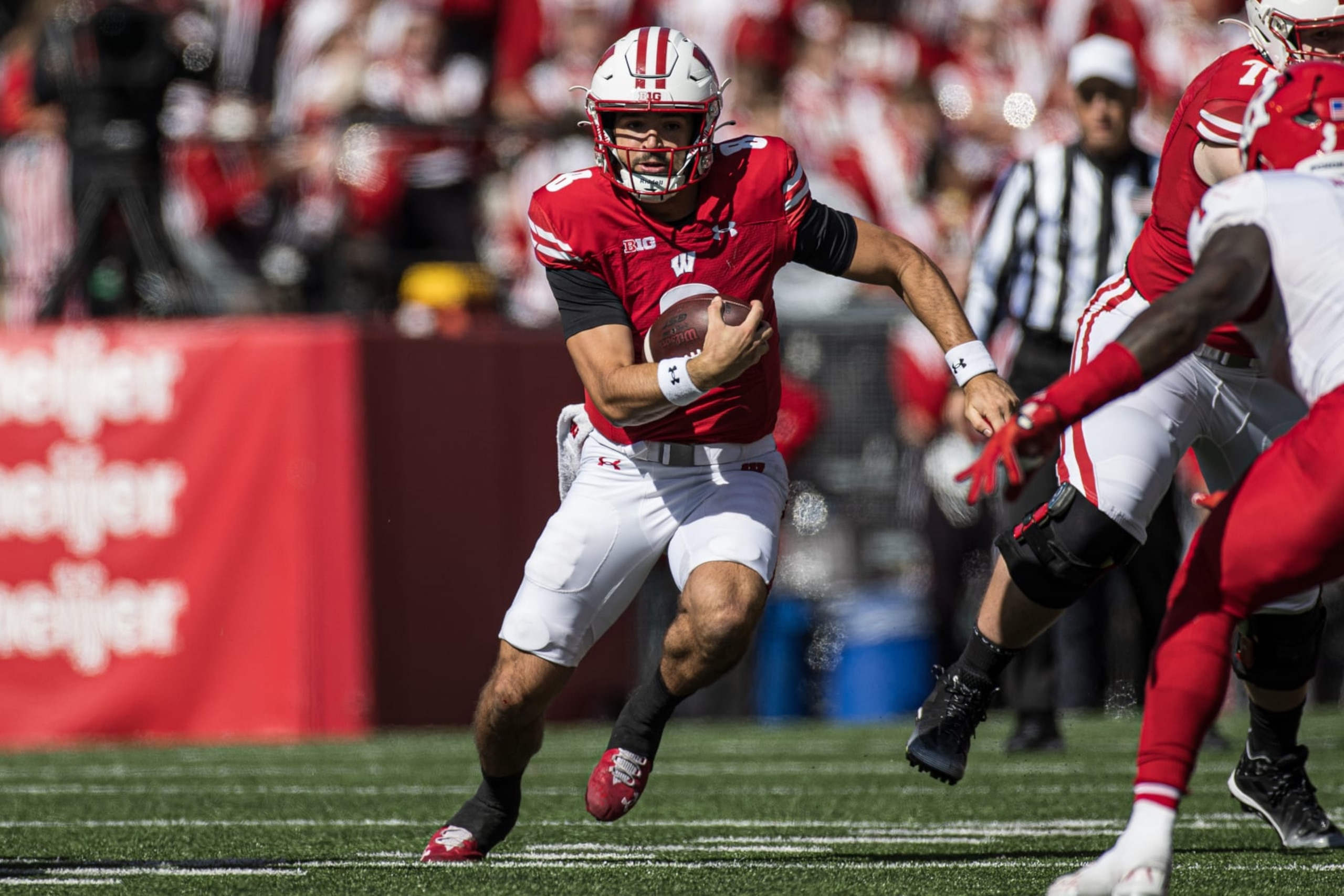 MADISON, WI - OCTOBER 07: Wisconsin Badgers quarterback Tanner Mordecai (8) scrambles for a first down durning a college football game between the Rutgers Scarlet Knights and the Wisconsin Badgers on October 7th, 2023 at Barry Alvarez field at Camp Randall Stadium in Madison, WI. (Photo by Dan Sanger/Icon Sportswire via Getty Images)