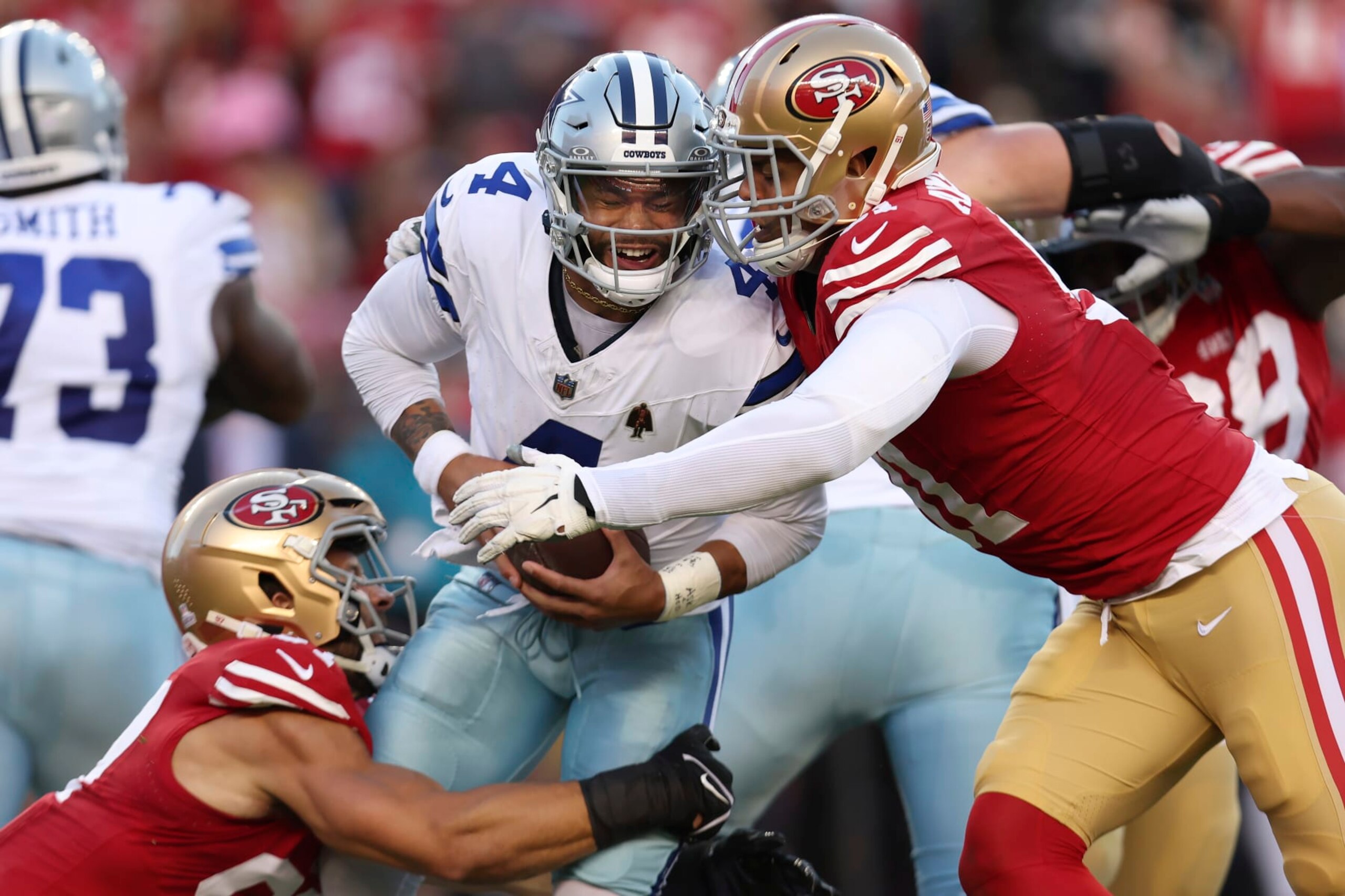 Dallas Cowboys quarterback Dak Prescott, middle, is sacked by San Francisco 49ers defensive end Nick Bosa, left, and defensive end Arik Armstead during the first half of an NFL football game in Santa Clara, Calif., Sunday, Oct. 8, 2023. (AP Photo/Jed Jacobsohn) Dallas Cowboys quarterback Dak Prescott, middle, is sacked by San Francisco 49ers defensive end Nick Bosa, left, and defensive end Arik Armstead during the first half of an NFL football game in Santa Clara, Calif., Sunday, Oct. 8, 2023. (AP Photo/Jed Jacobsohn)