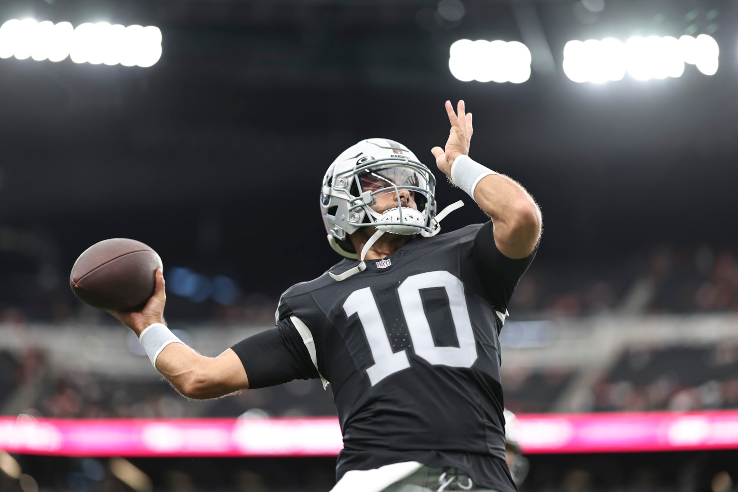 LAS VEGAS, NEVADA - AUGUST 13: Jimmy Garoppolo #10 of the Las Vegas Raiders passes as he warms up prior to a game between the San Francisco 49ers and the Las Vegas Raiders at Allegiant Stadium on August 13, 2023 in Las Vegas, Nevada. (Photo by Michael Owens/Getty Images)