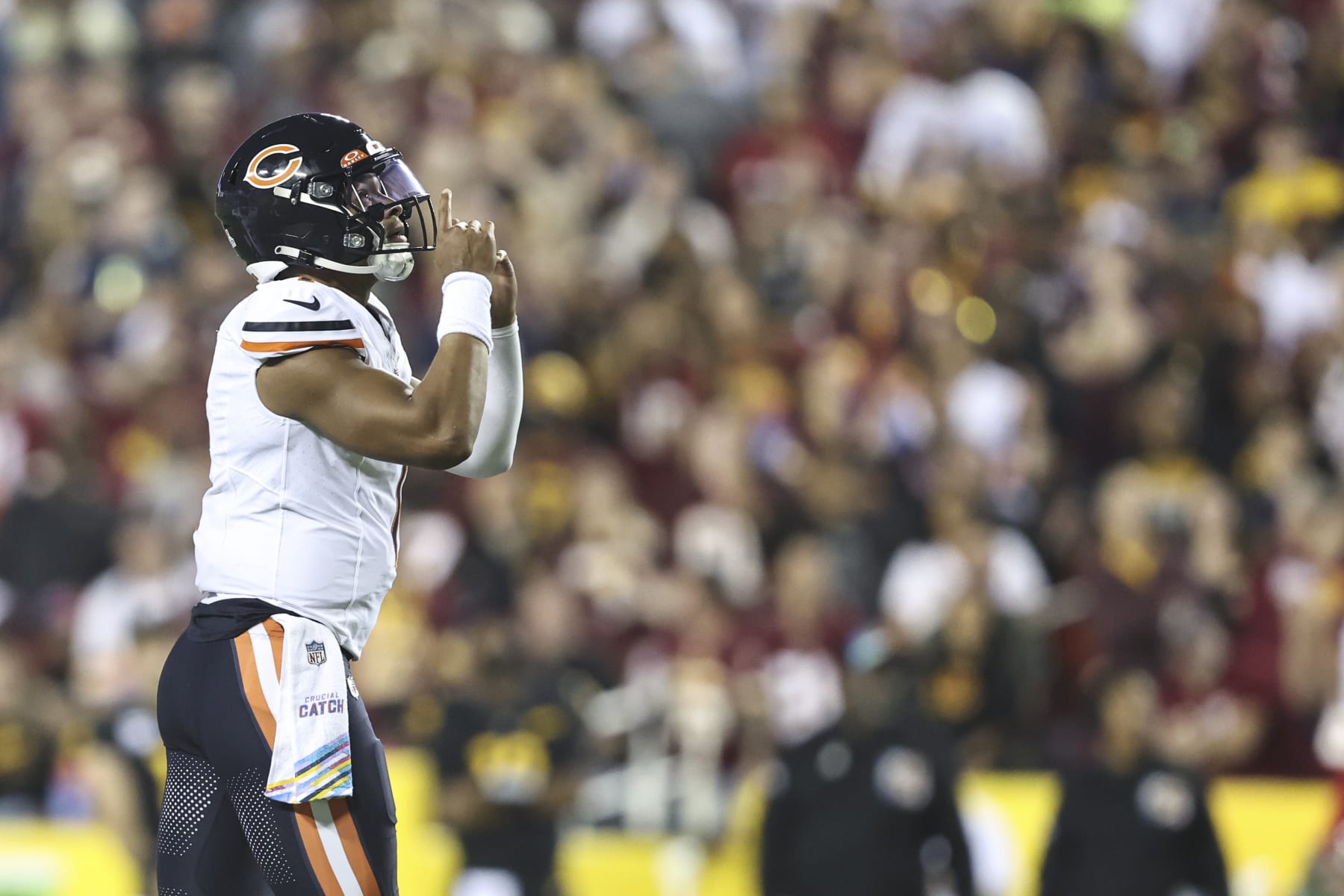 LANDOVER, MARYLAND - OCTOBER 05: Justin Fields #1 of the Chicago Bears celebrates after passing to DJ Moore #2 of the Chicago Bears for a touchdown during an NFL football game between the Washington Commanders and the Chicago Bears at FedExField on October 05, 2023 in Landover, Maryland. (Photo by Michael Owens/Getty Images)