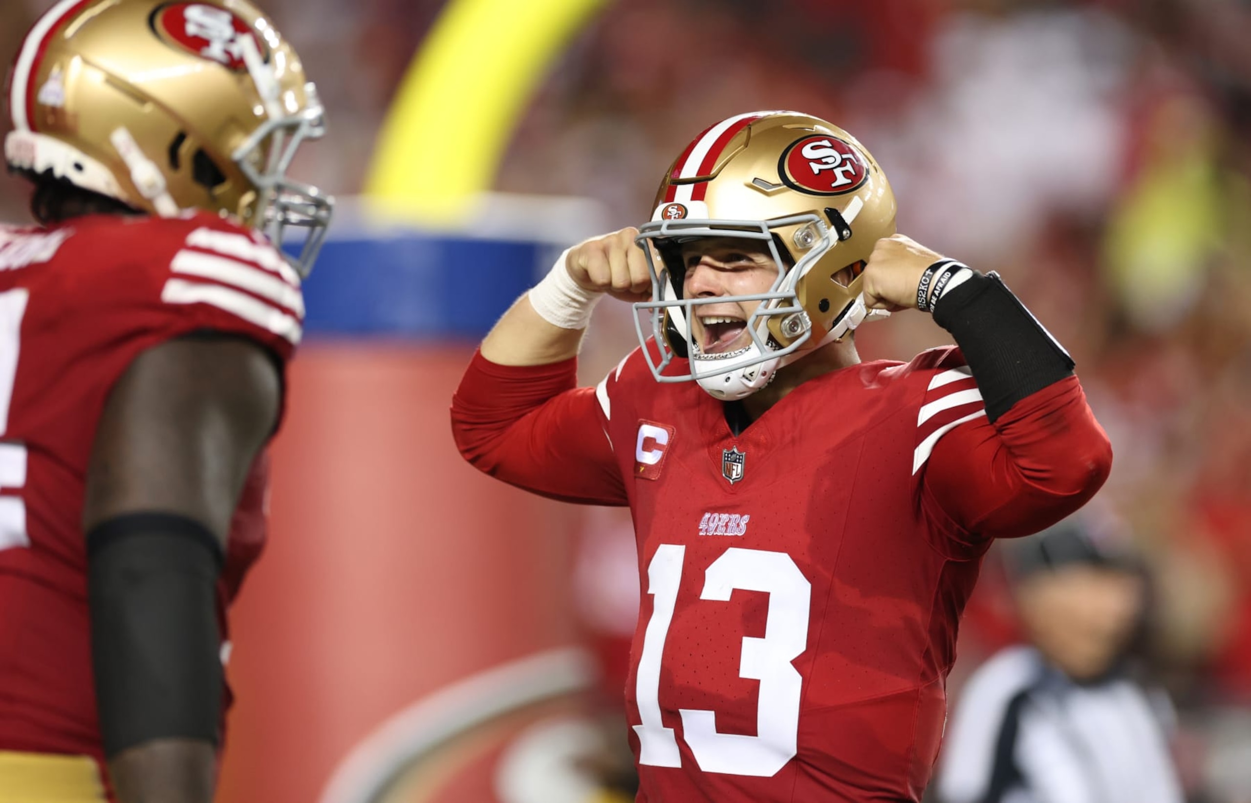 SANTA CLARA, CALIFORNIA - OCTOBER 08: Brock Purdy #13 of the San Francisco 49ers celebrates after a touchdown by Jordan Mason #24 during the fourth quarter against the Dallas Cowboys at Levi's Stadium on October 08, 2023 in Santa Clara, California. (Photo by Ezra Shaw/Getty Images)