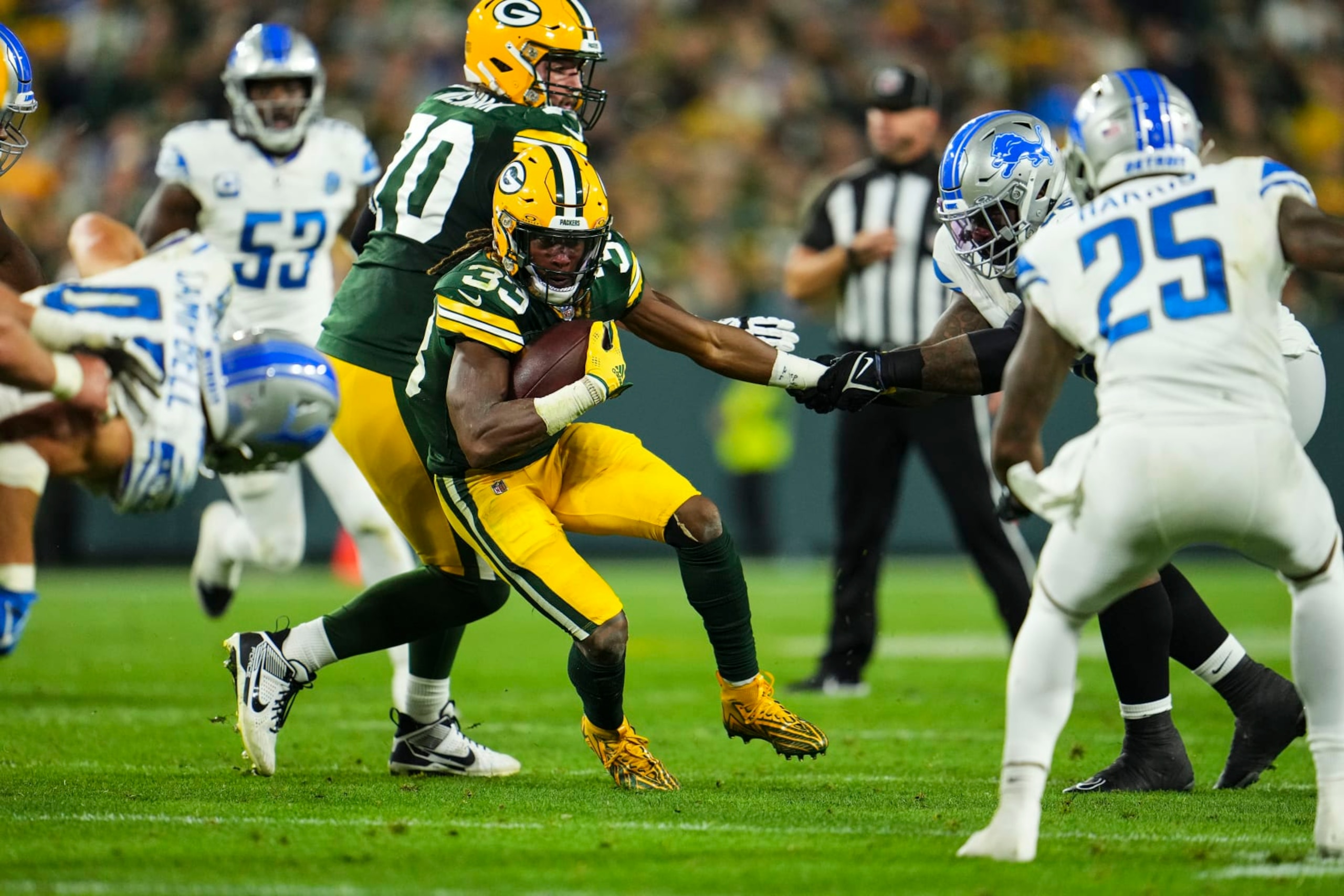 GREEN BAY, WI - SEPTEMBER 28: Aaron Jones #33 of the Green Bay Packers runs the ball during an NFL football game at Lambeau Field on September 28, 2023 in Green Bay, Wisconsin. (Photo by Cooper Neill/Getty Images)