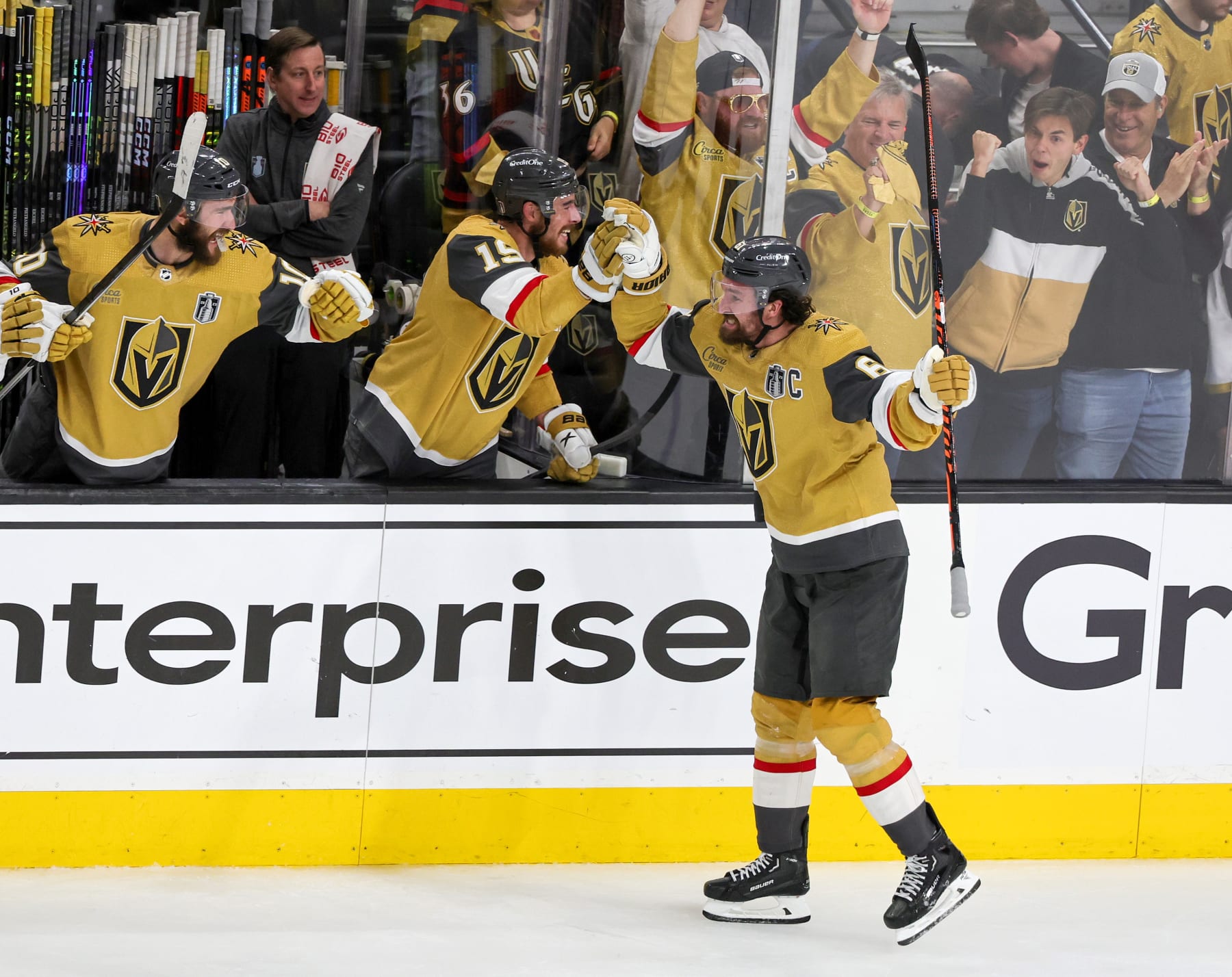 LAS VEGAS, NEVADA - JUNE 13: Mark Stone #61 of the Vegas Golden Knights celebrates his goal against the Florida Panthers with Nicolas Roy #10 and Reilly Smith #19 on the bench in the second period of Game Five of the 2023 NHL Stanley Cup Final at T-Mobile Arena on June 13, 2023 in Las Vegas, Nevada. The Golden Knights defeated the Panthers 9-3 to win the series four games to one. (Photo by Ethan Miller/Getty Images)