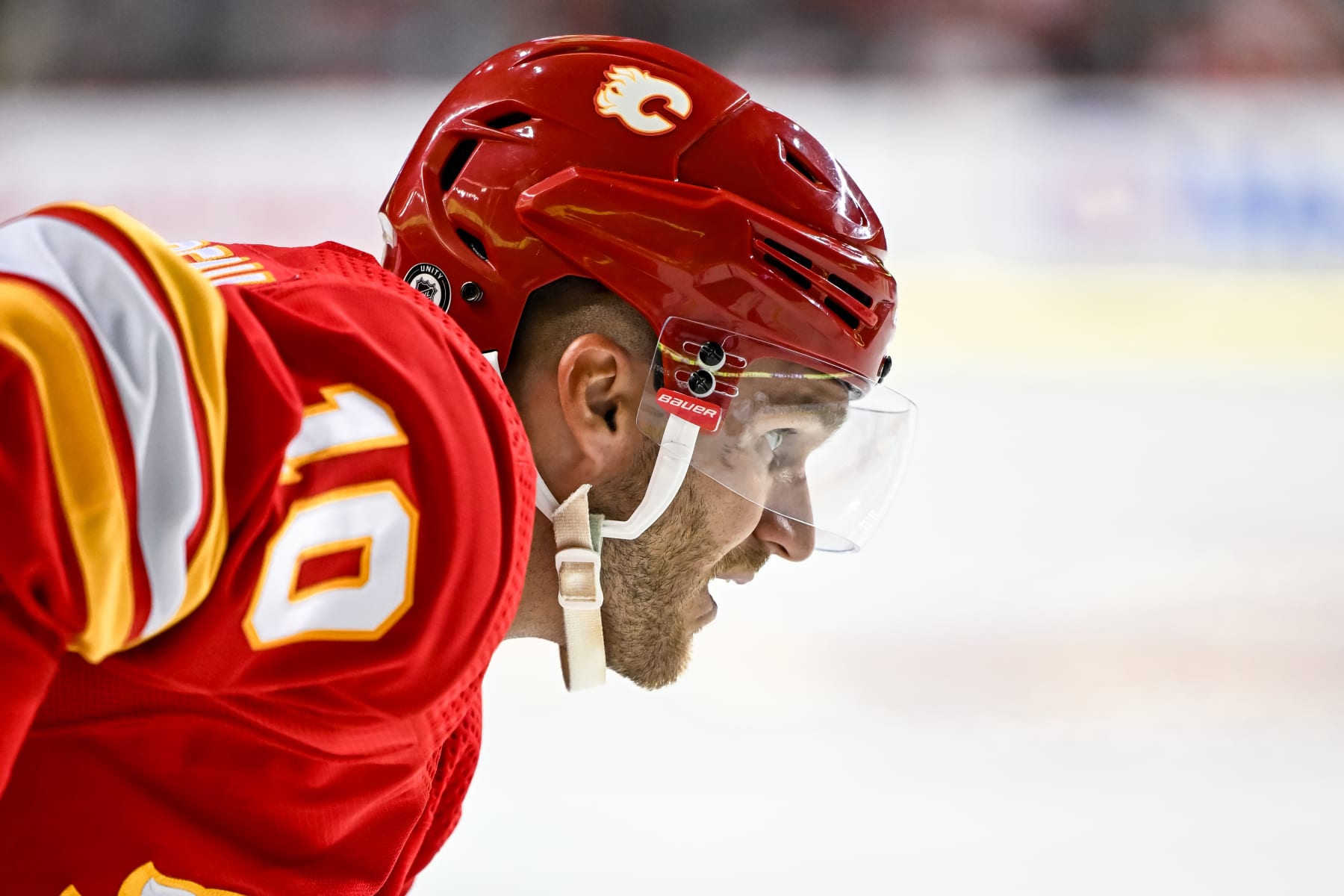 CALGARY, AB - OCTOBER 02: Calgary Flames Left Wing Jonathan Huberdeau (10) gets ready for a faceoff during the third period of an NHL preseason game between the Calgary Flames and the Winnipeg Jets on October 2, 2023, at the Scotiabank Saddledome in Calgary, AB. (Photo by Brett Holmes/Icon Sportswire via Getty Images)